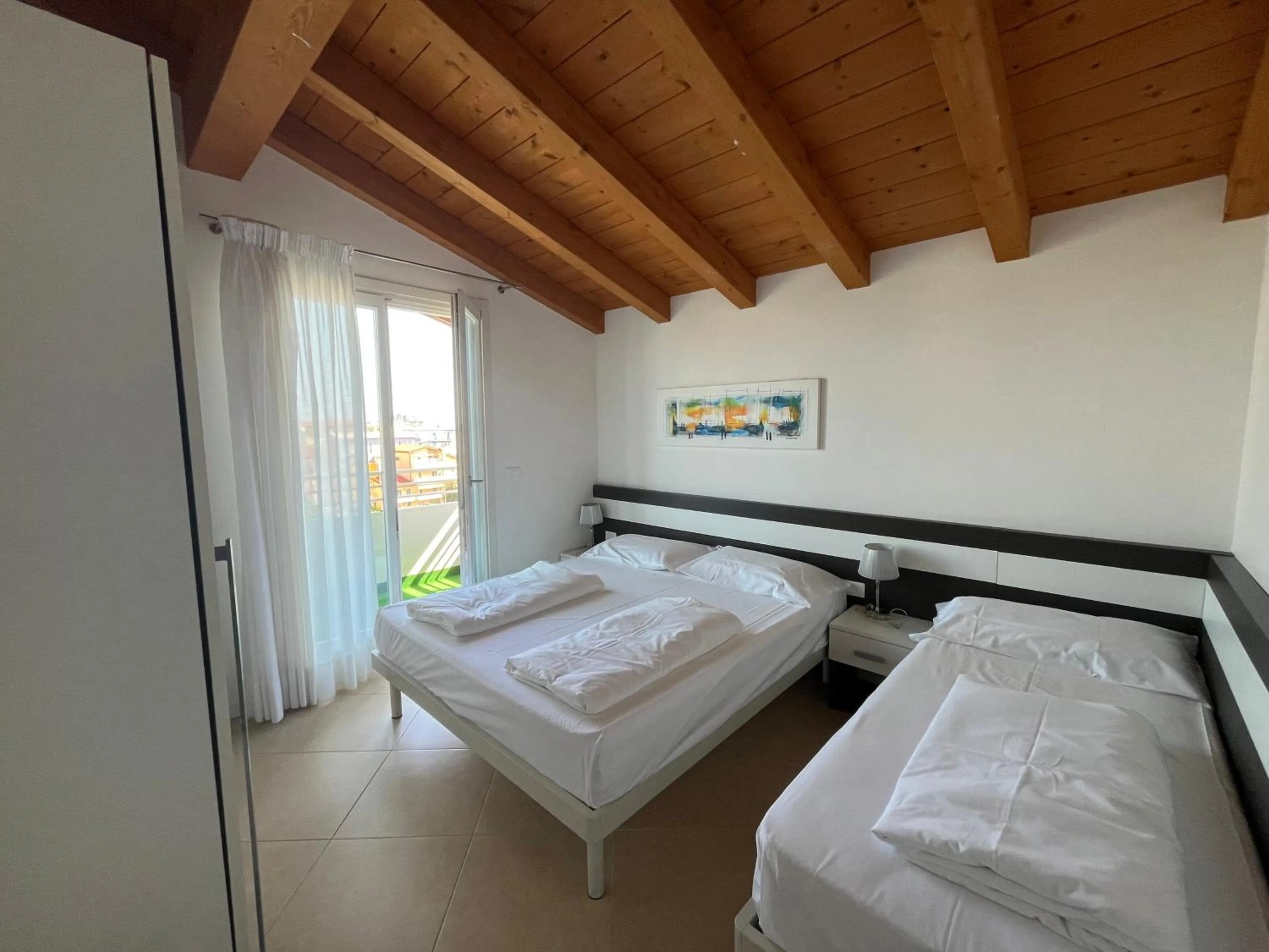 Bed in Villaggio Hemingway - Family Aparthotel