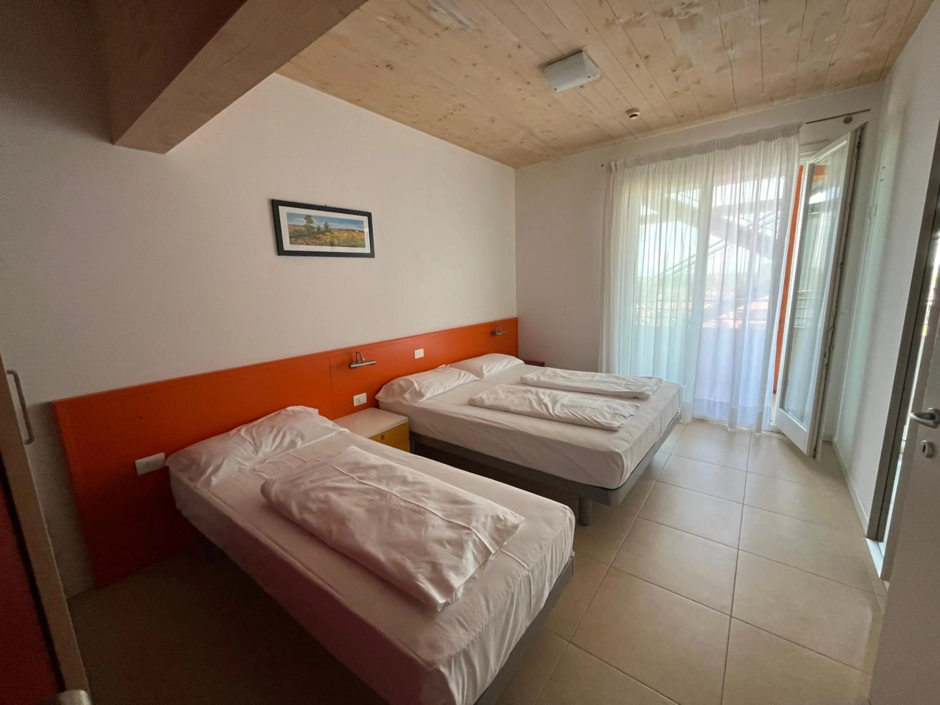 Bed in Villaggio Hemingway - Family Aparthotel