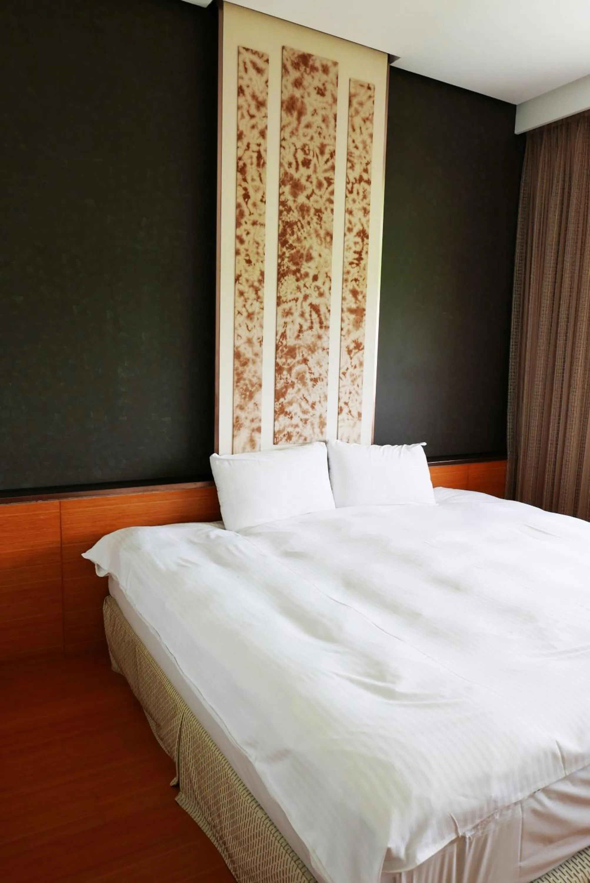 Bed in Zhi Da Craft Service Guest House
