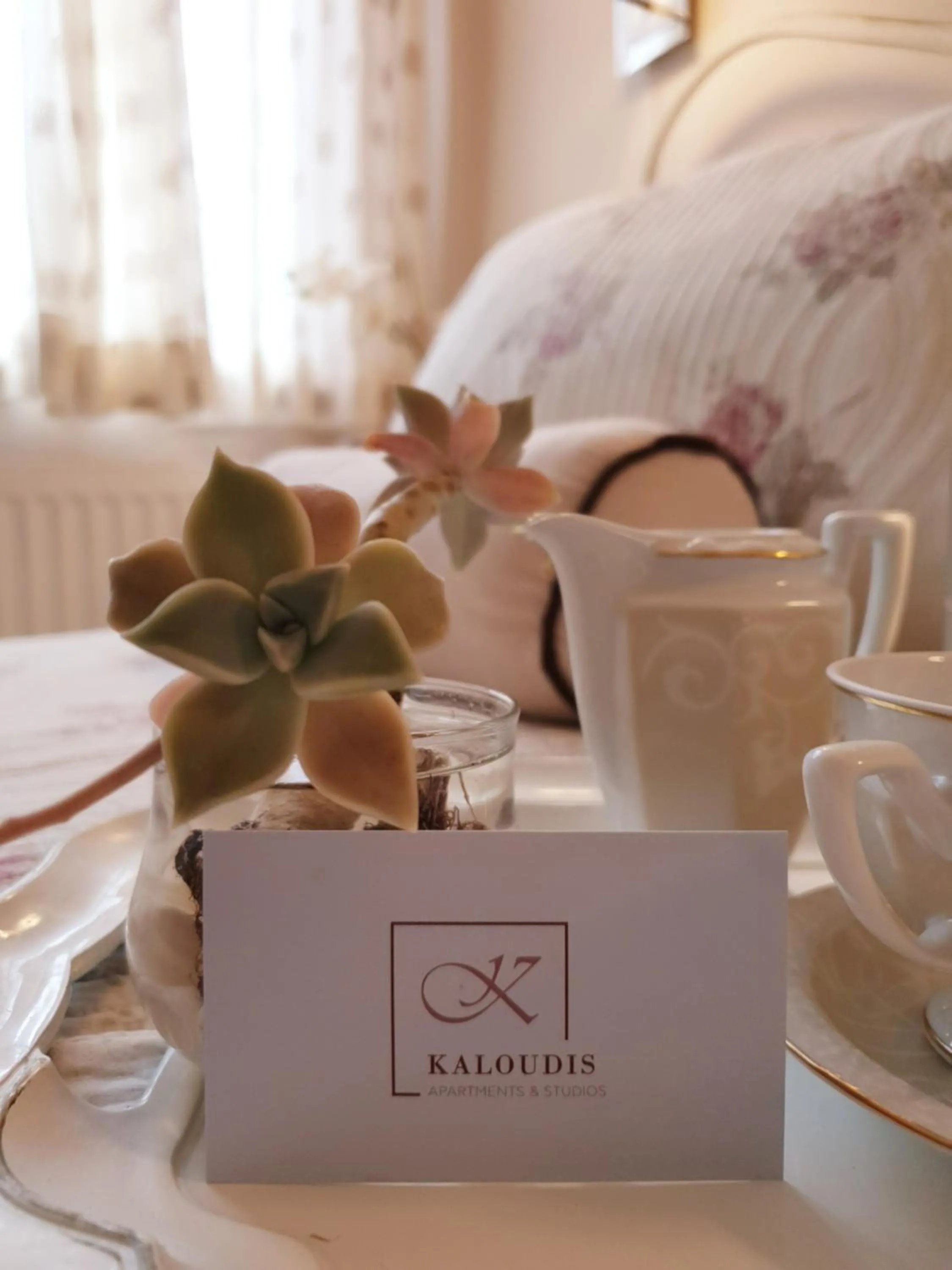 Property logo or sign, Bed in Kaloudis Studios & Apartments