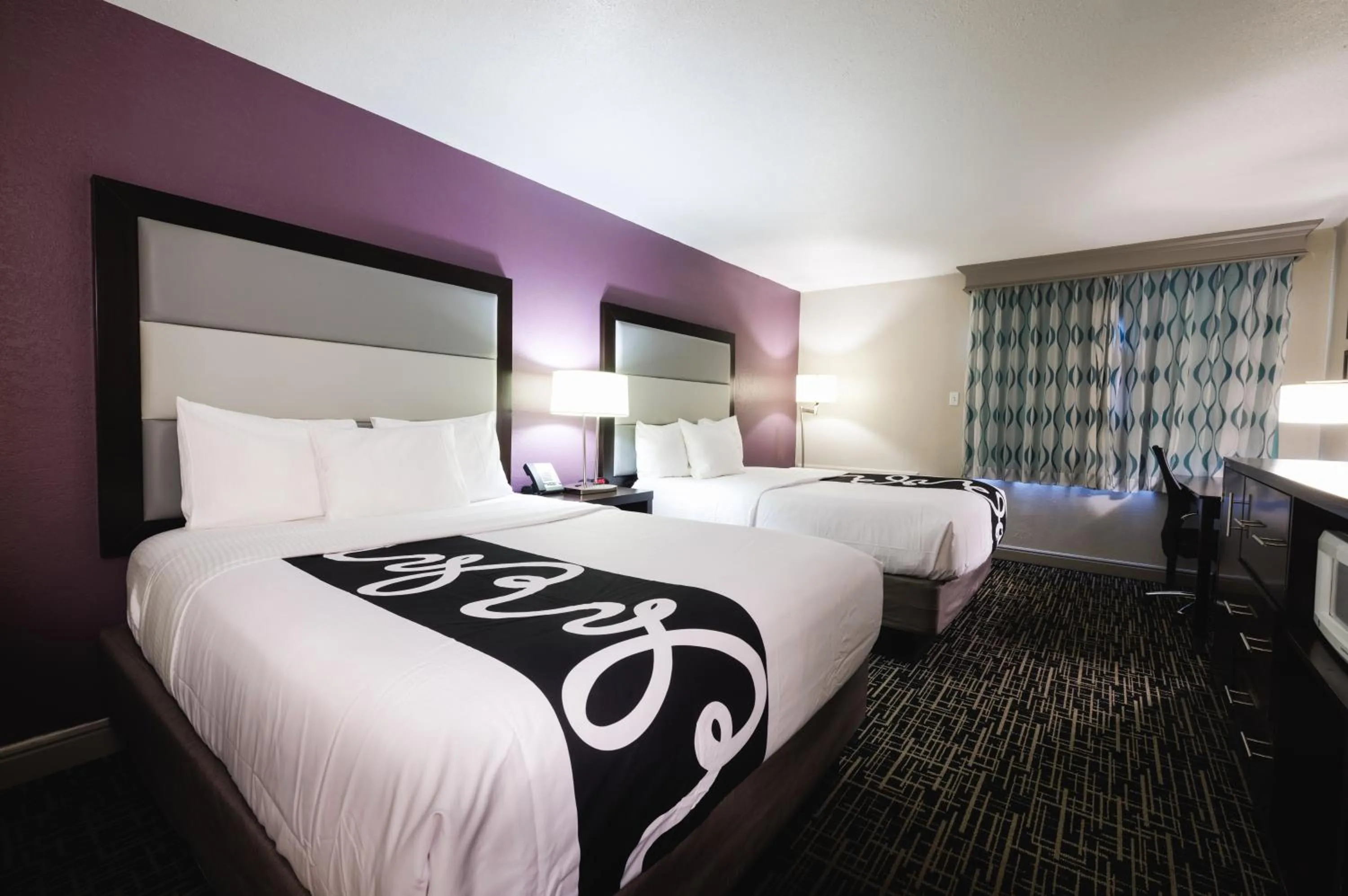 Bed in La Quinta Inn & Suites by Wyndham Fort Collins, Colorado