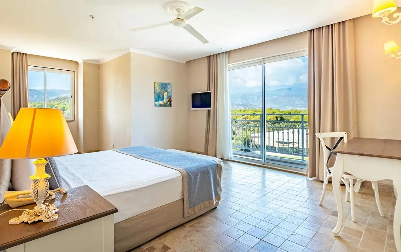 Bedroom, Bed in Andriake Beach Club Hotel - All Inclusive