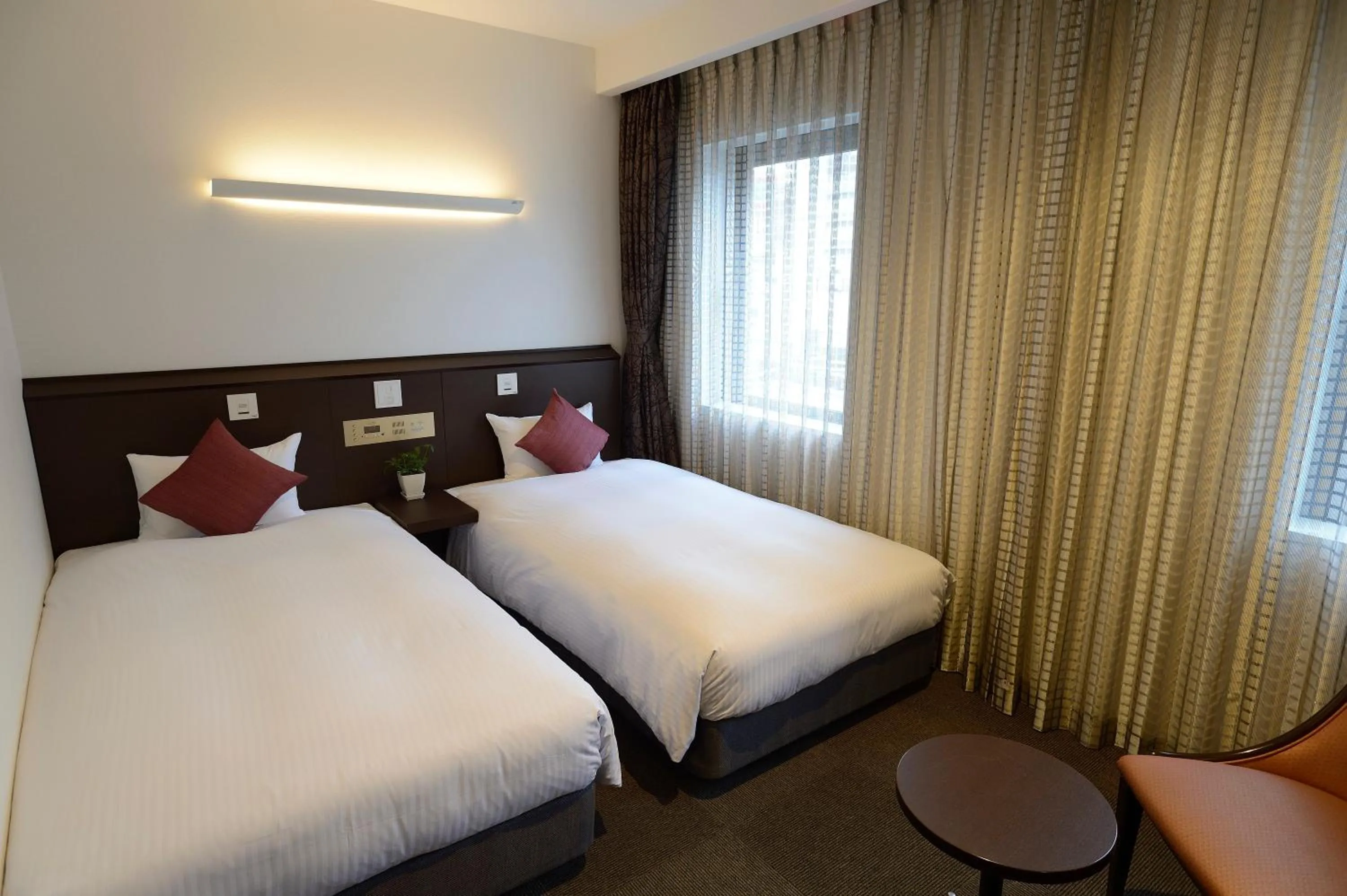 Bed in Natural Hot Spring Midosuji Hotel