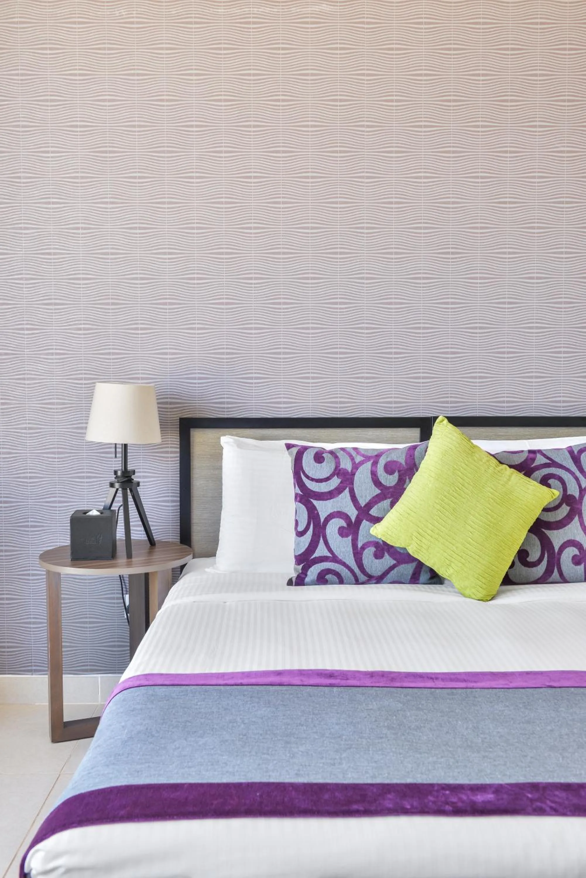 Bed in Nassima Tower Hotel Apartments