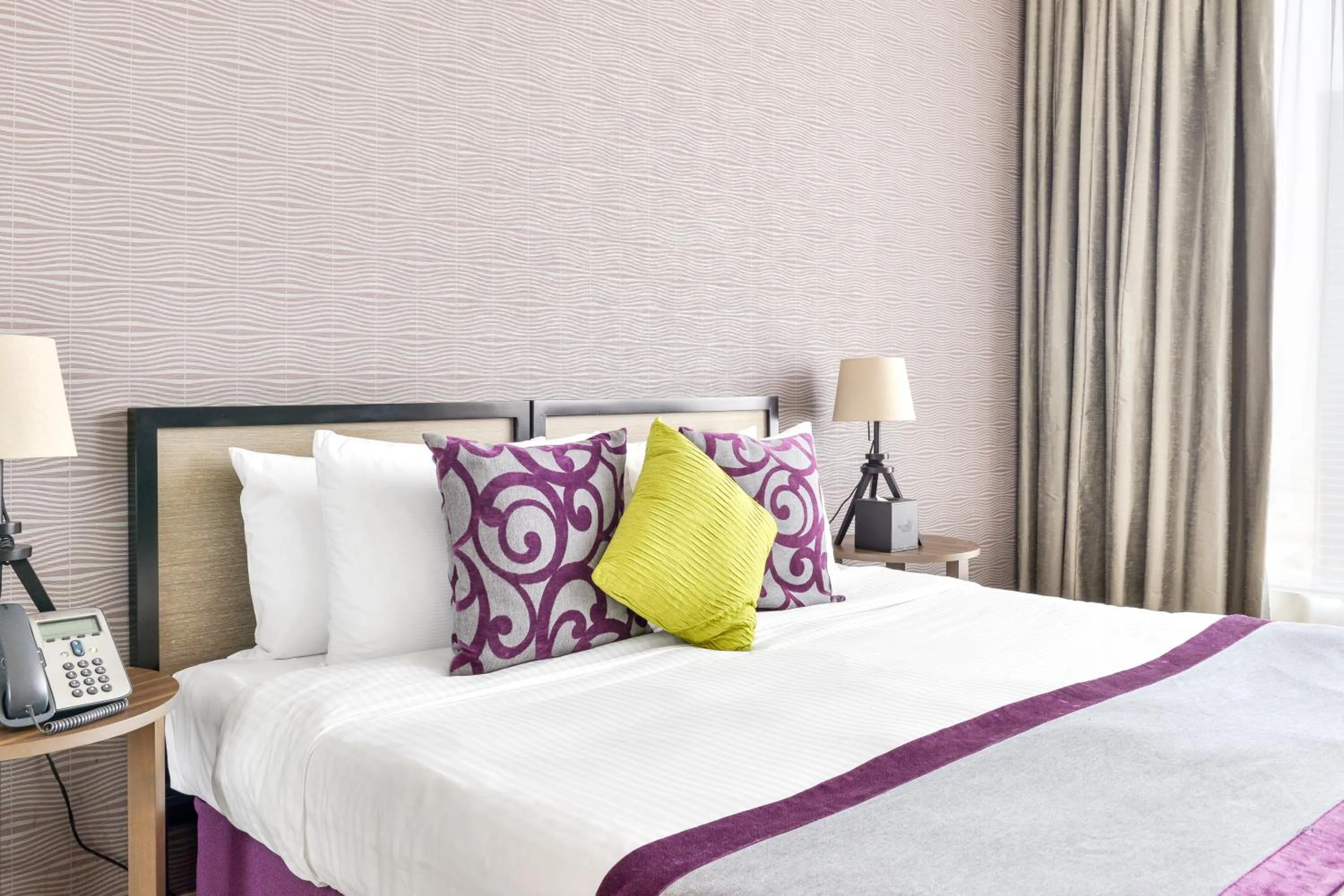 Bed in Nassima Tower Hotel Apartments