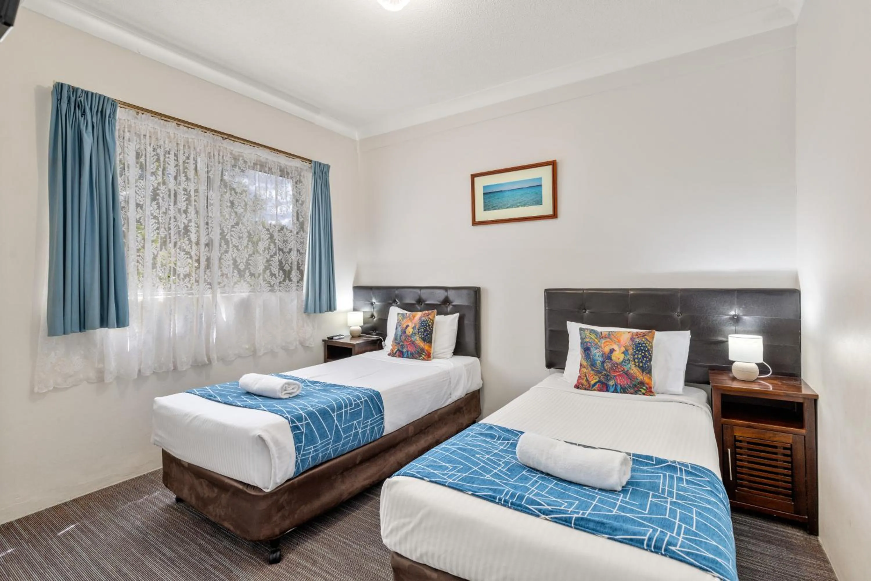 Bed in Sanctuary Resort Motor Inn