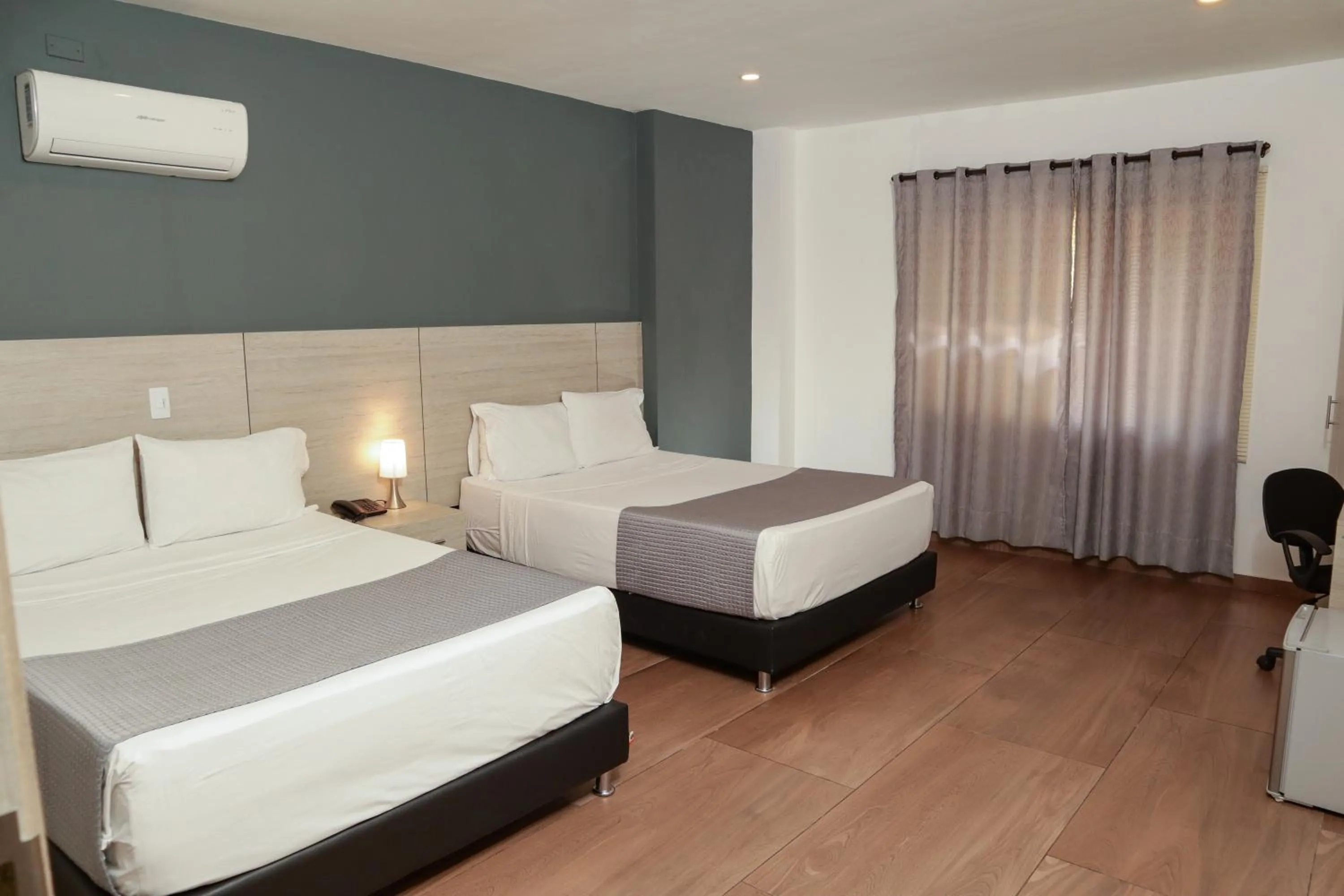 Bed in Basic Hotel Chipichape by Hoteles MS