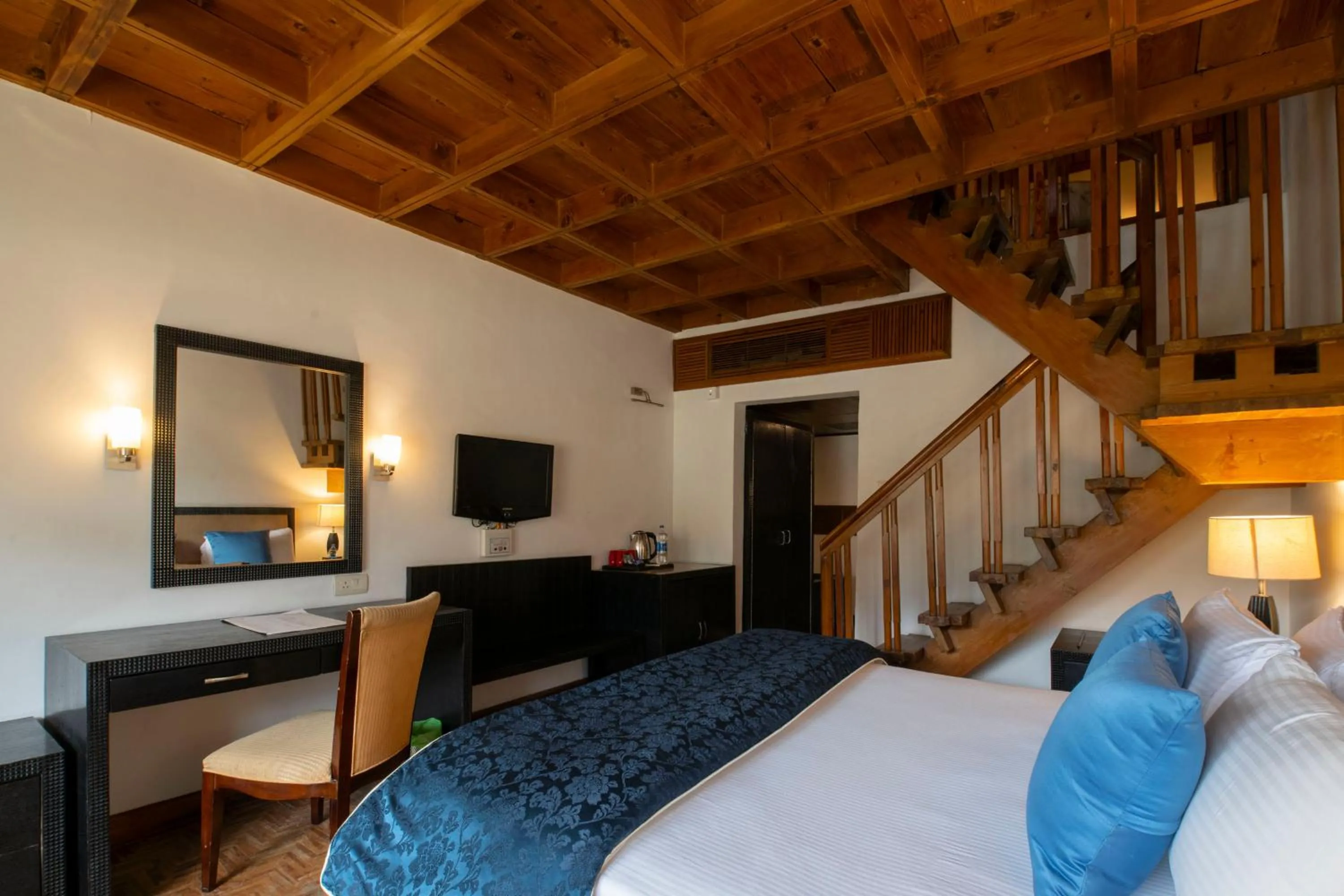 Bed in Mastiff Grand Manali Resort