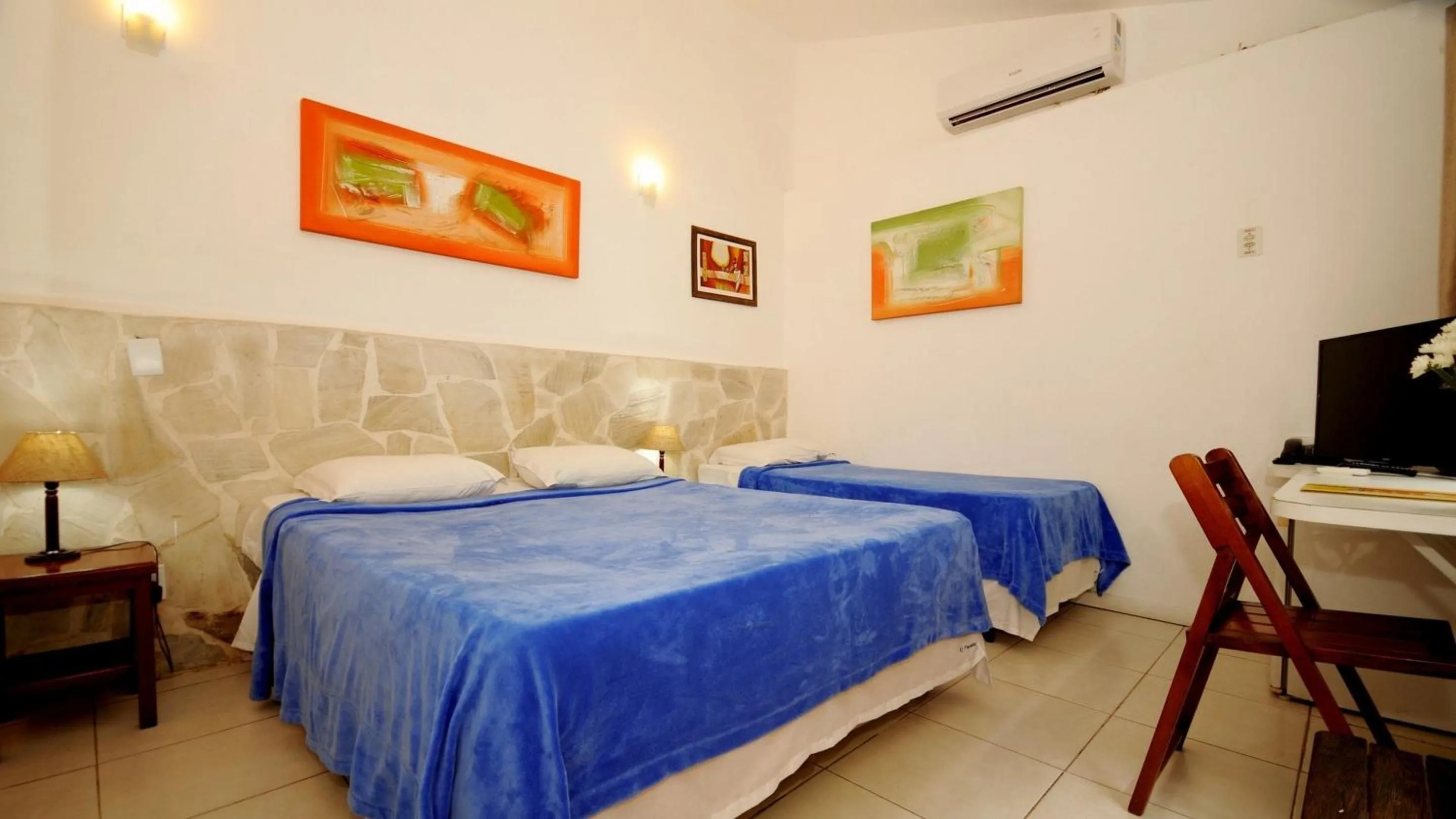 Bed in Pousada El Parador