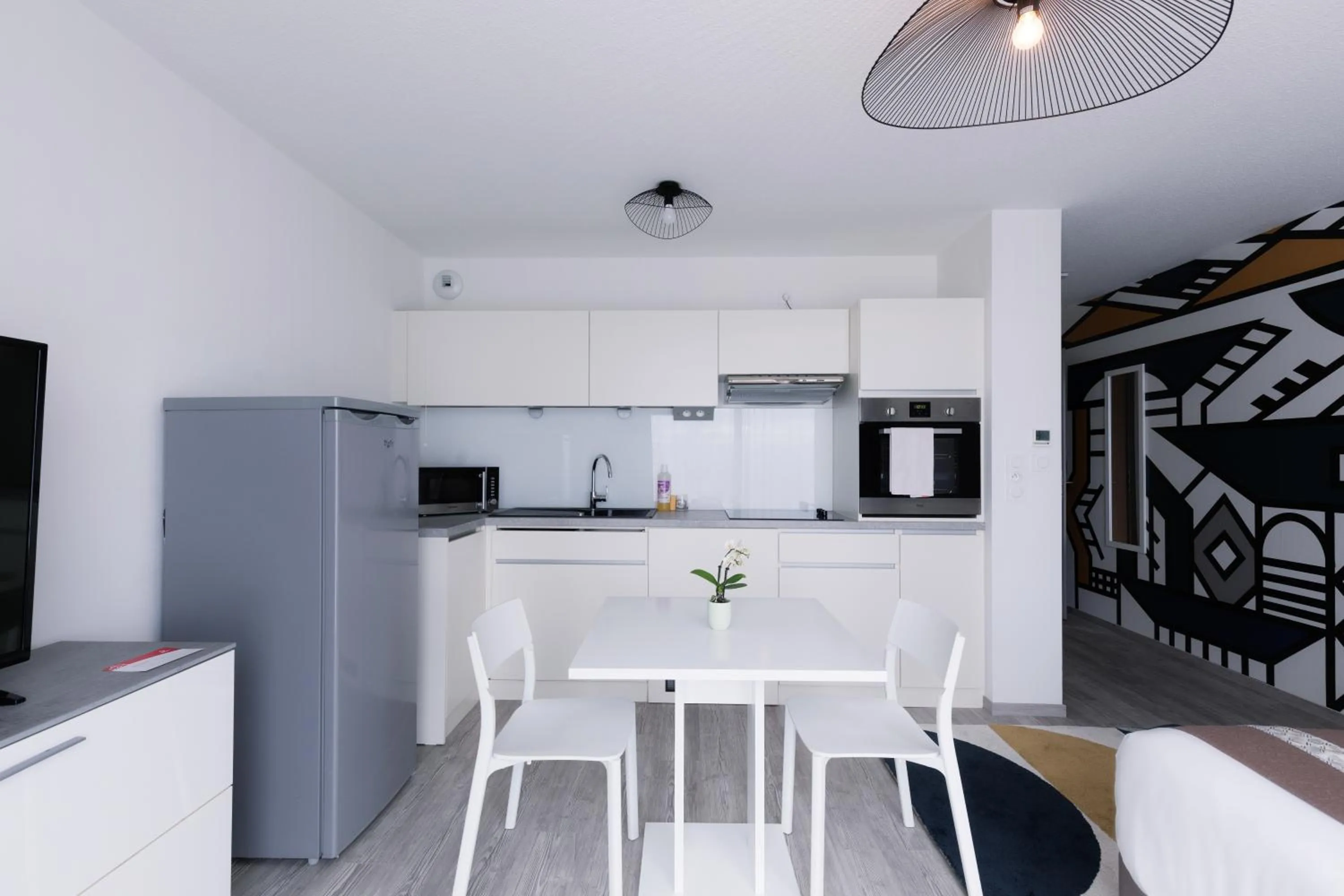 Kitchen or kitchenette in Aparthotel Adagio Bâle Mulhouse Aeroport