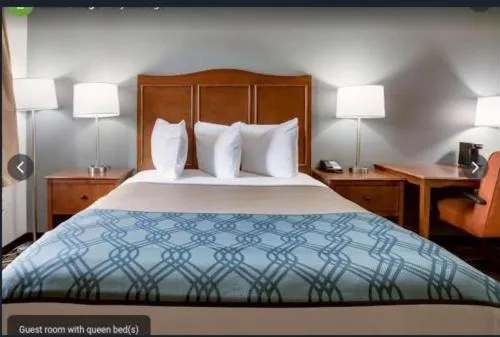 Bedroom, Bed in Travelodge by Wyndham Canton-Livonia Area, MI