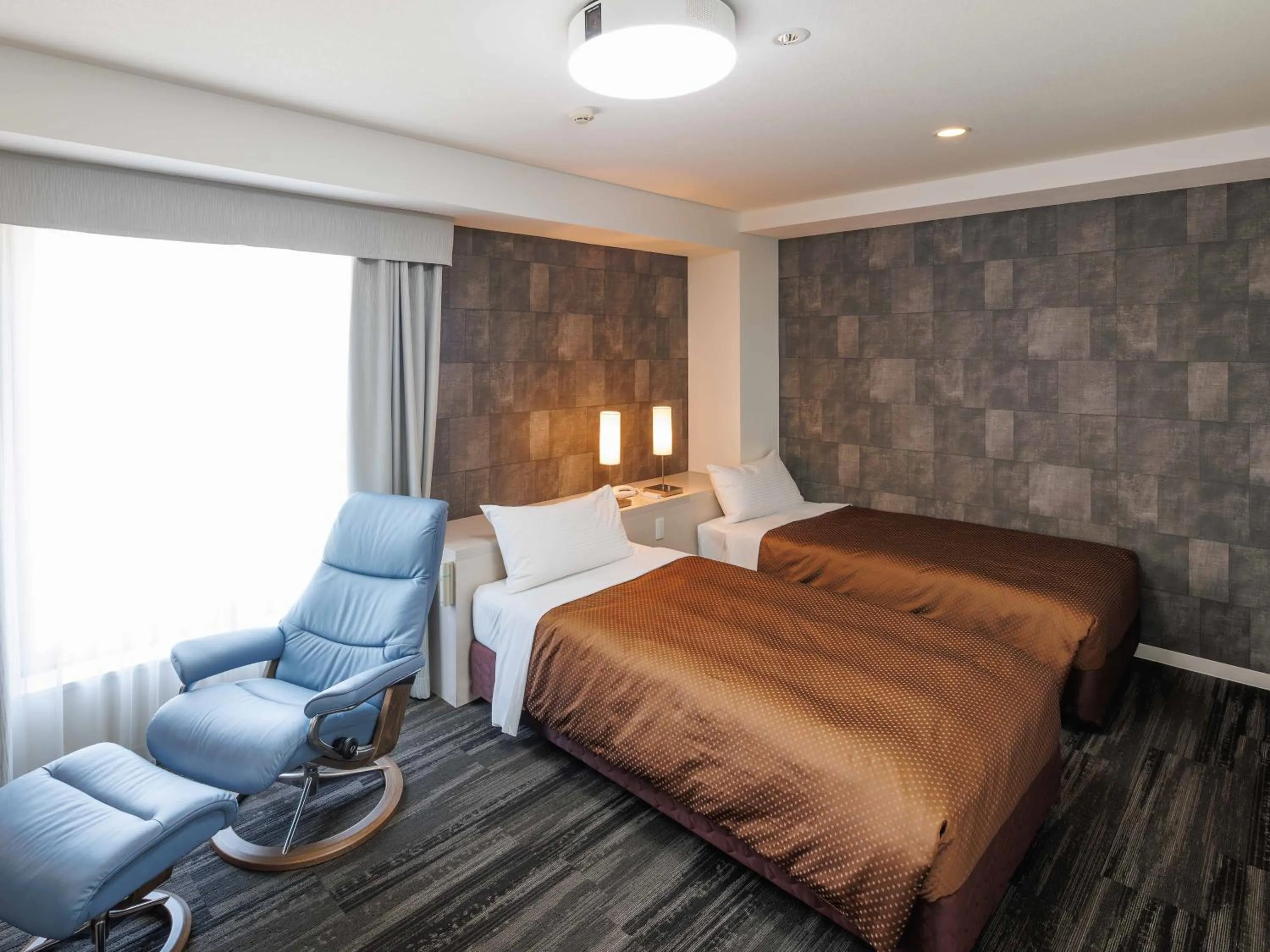 Bed in J Hotel Rinku