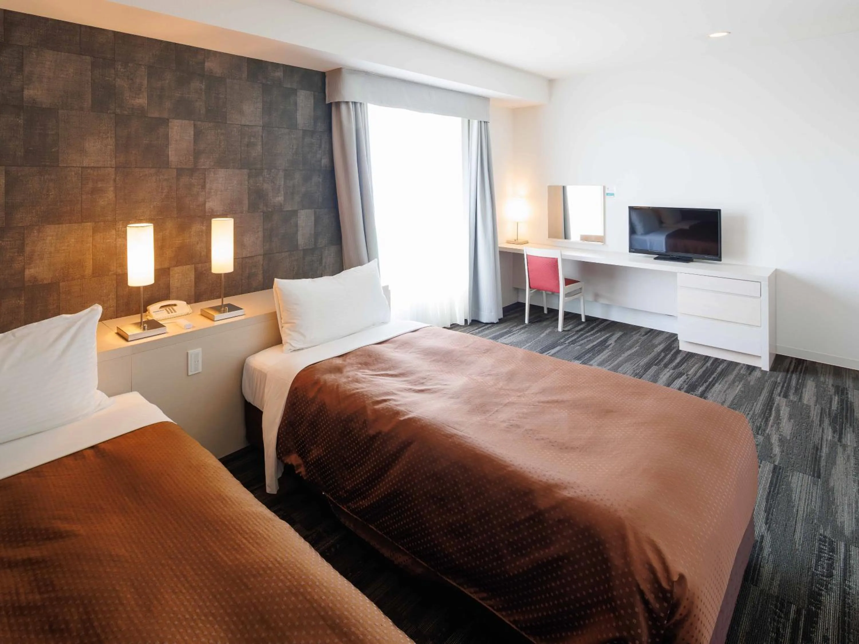 Bed in J Hotel Rinku