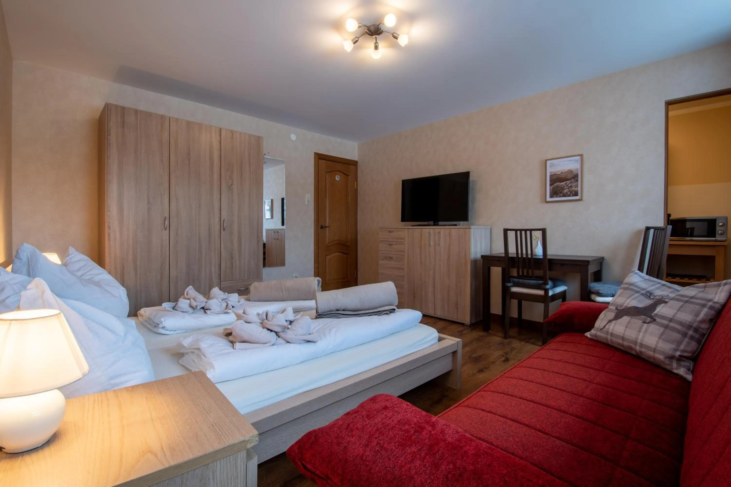Living room, Bed in Bergzeit Appartments