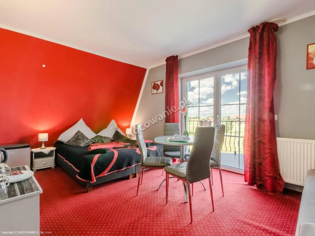 Living room in Willa Cyklada, grill, śniadania, jezioro,przystań,tawerna-200m, park linowy-400m, centrum,aquapark-900m