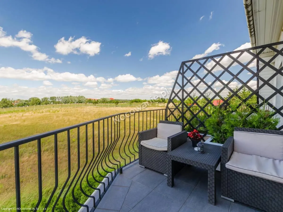 Balcony/Terrace in Willa Cyklada, grill, śniadania, jezioro,przystań,tawerna-200m, park linowy-400m, centrum,aquapark-900m