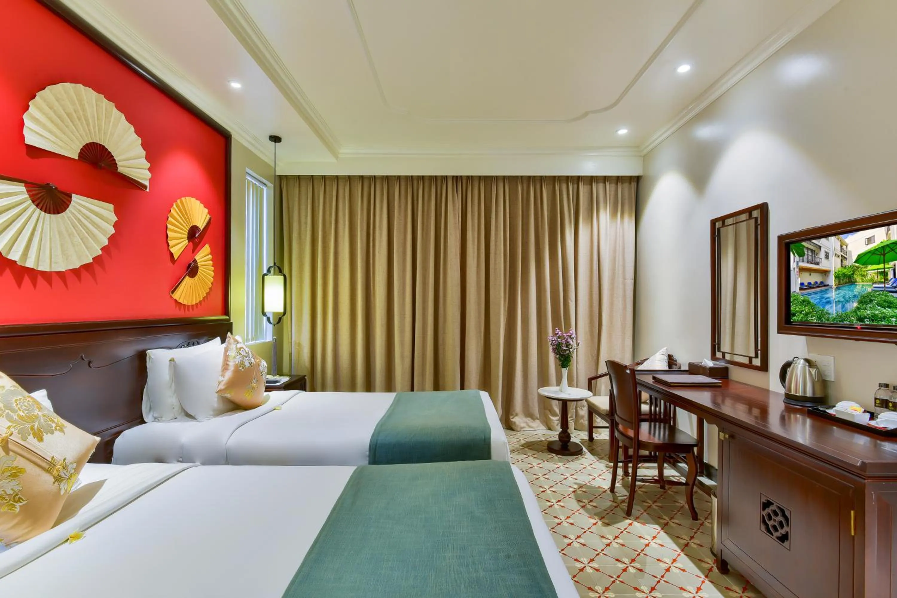 Communal lounge/ TV room, Bed in Laluna Hoi An Riverside Hotel & Spa
