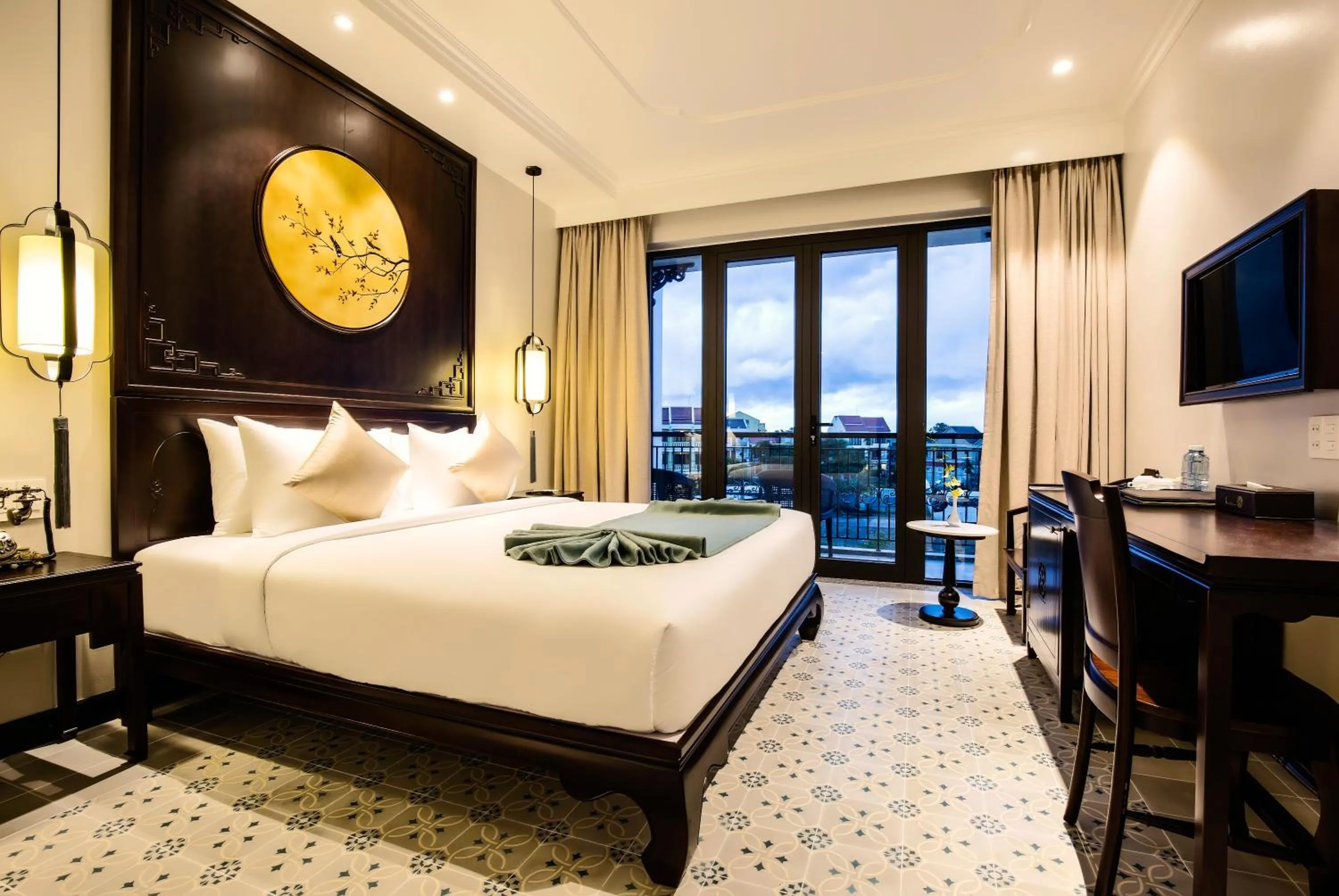 Communal lounge/ TV room, Bed in Laluna Hoi An Riverside Hotel & Spa