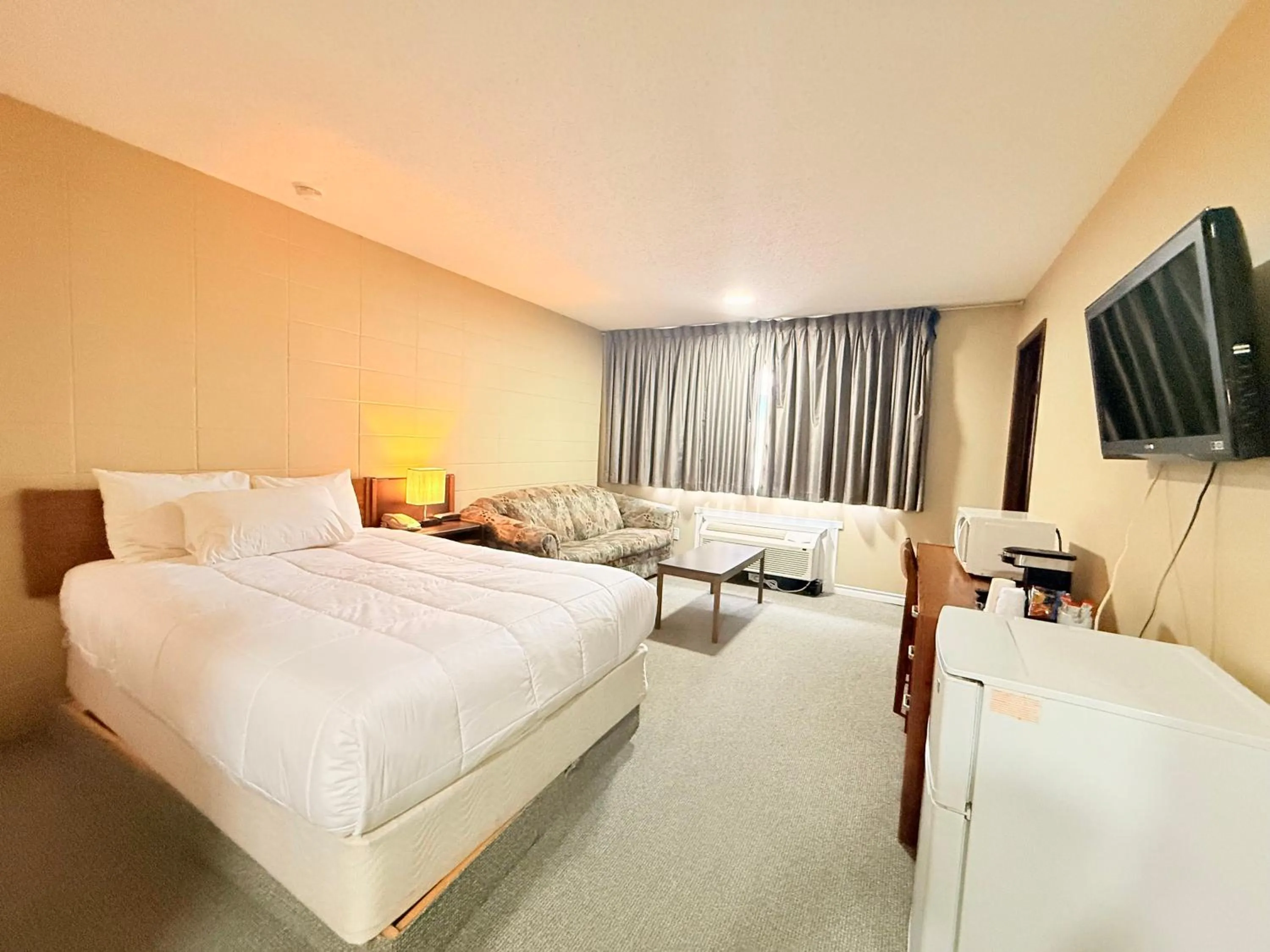 Bed in Capri Motor Inn