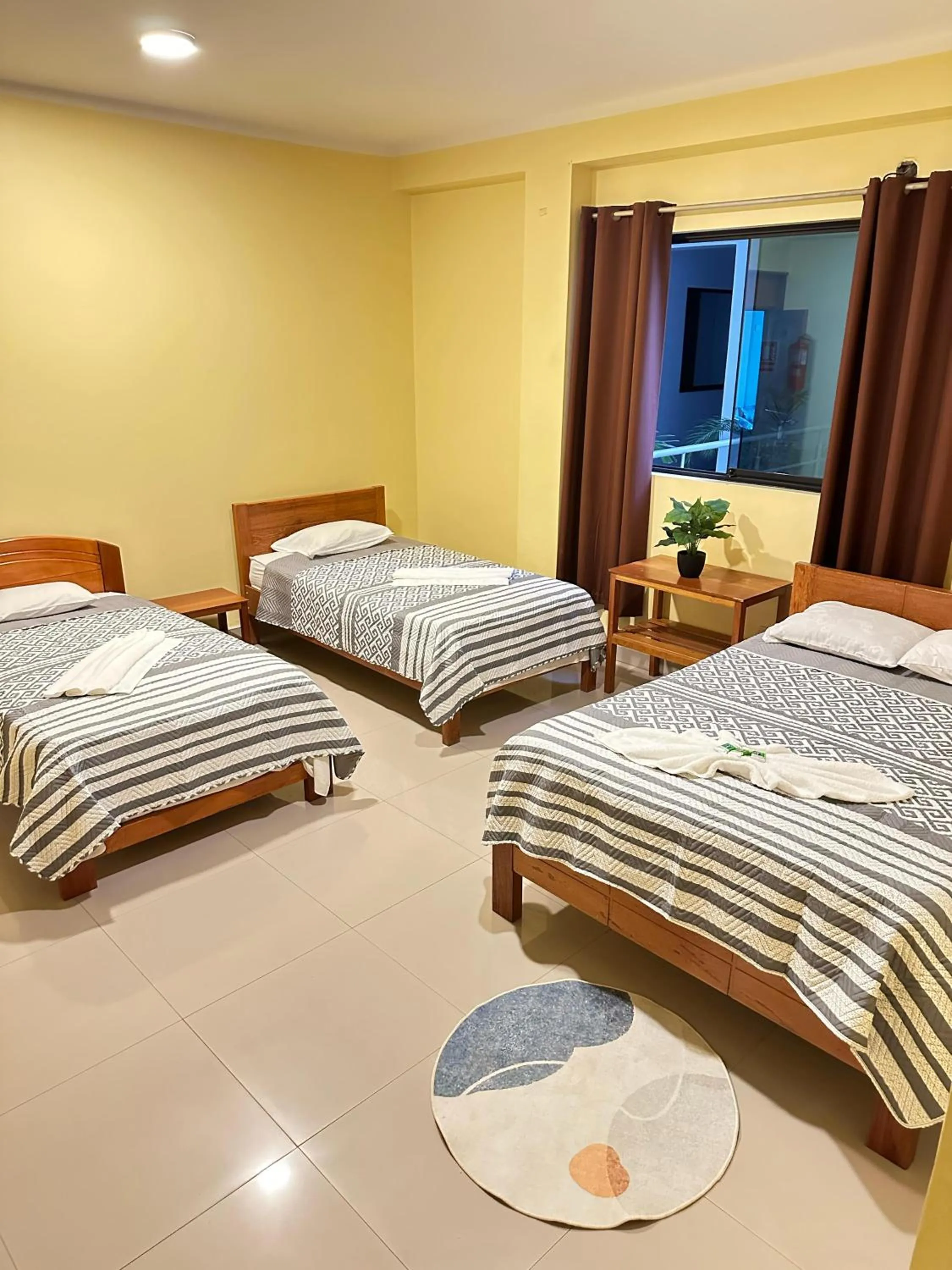 Bed in Hostal Cordillera Azul