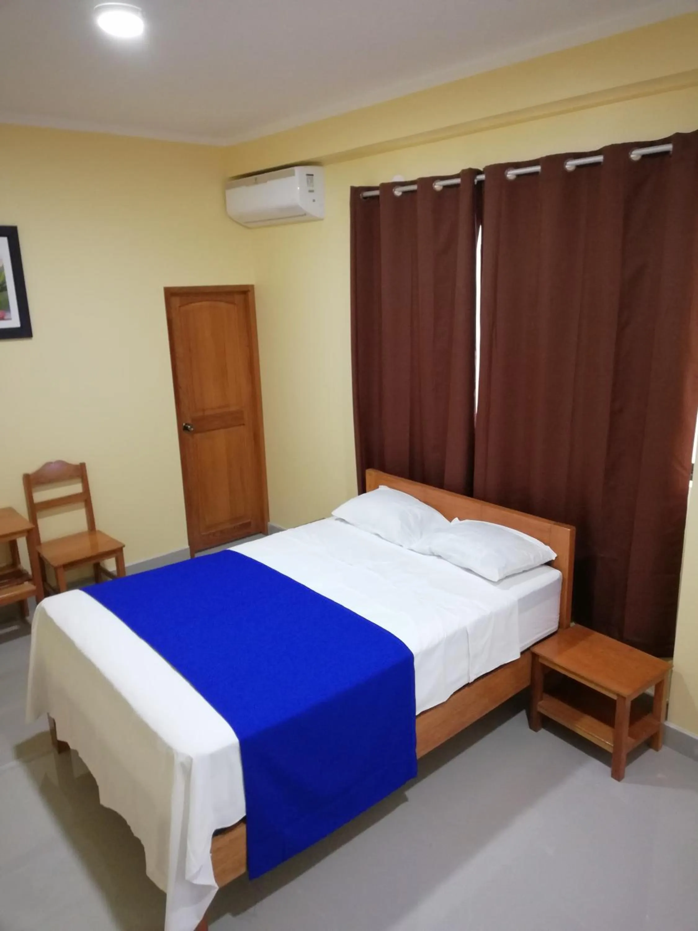 Bed in Hostal Cordillera Azul