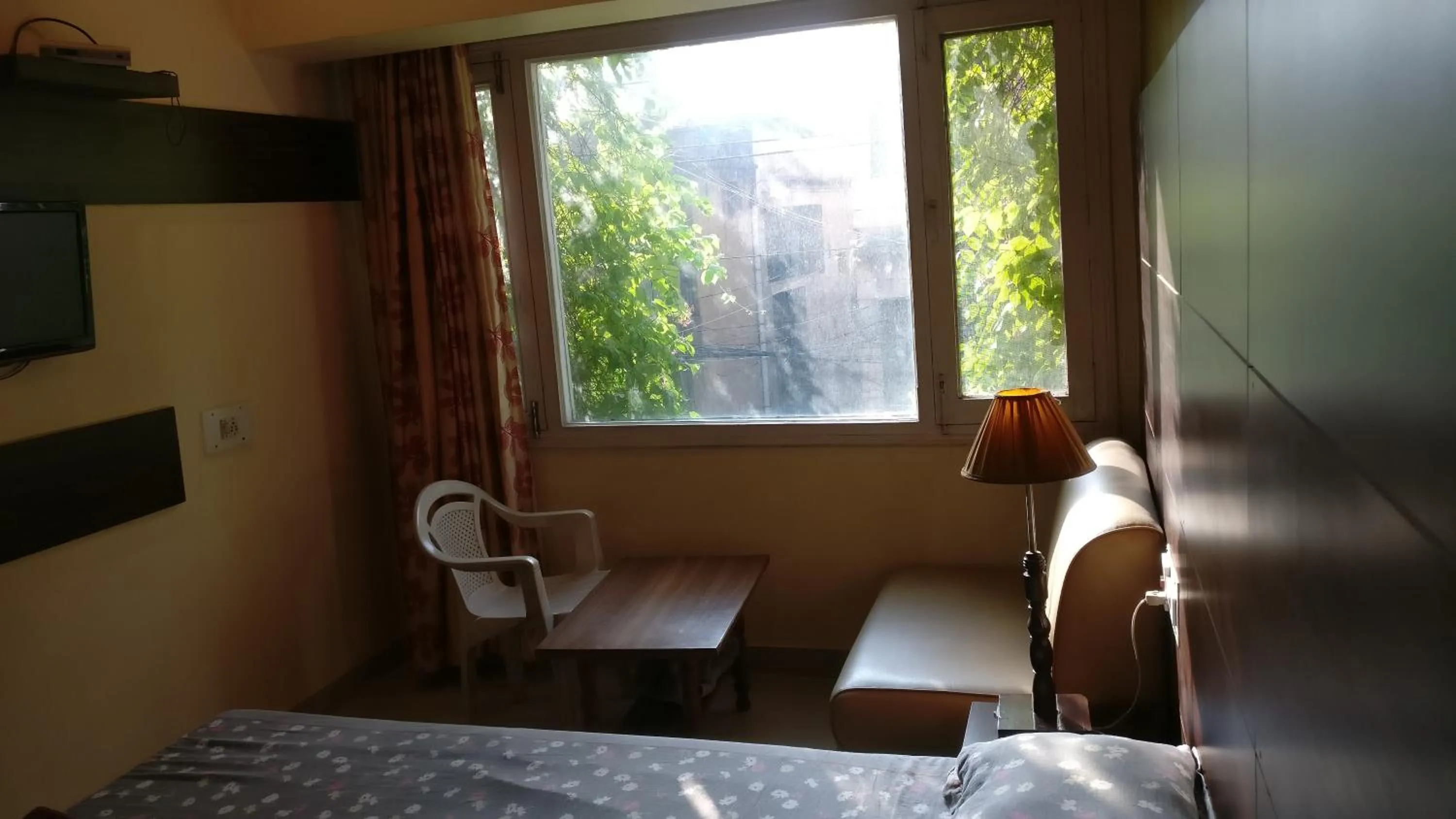 Seating area, Bed in Samrat Hotel