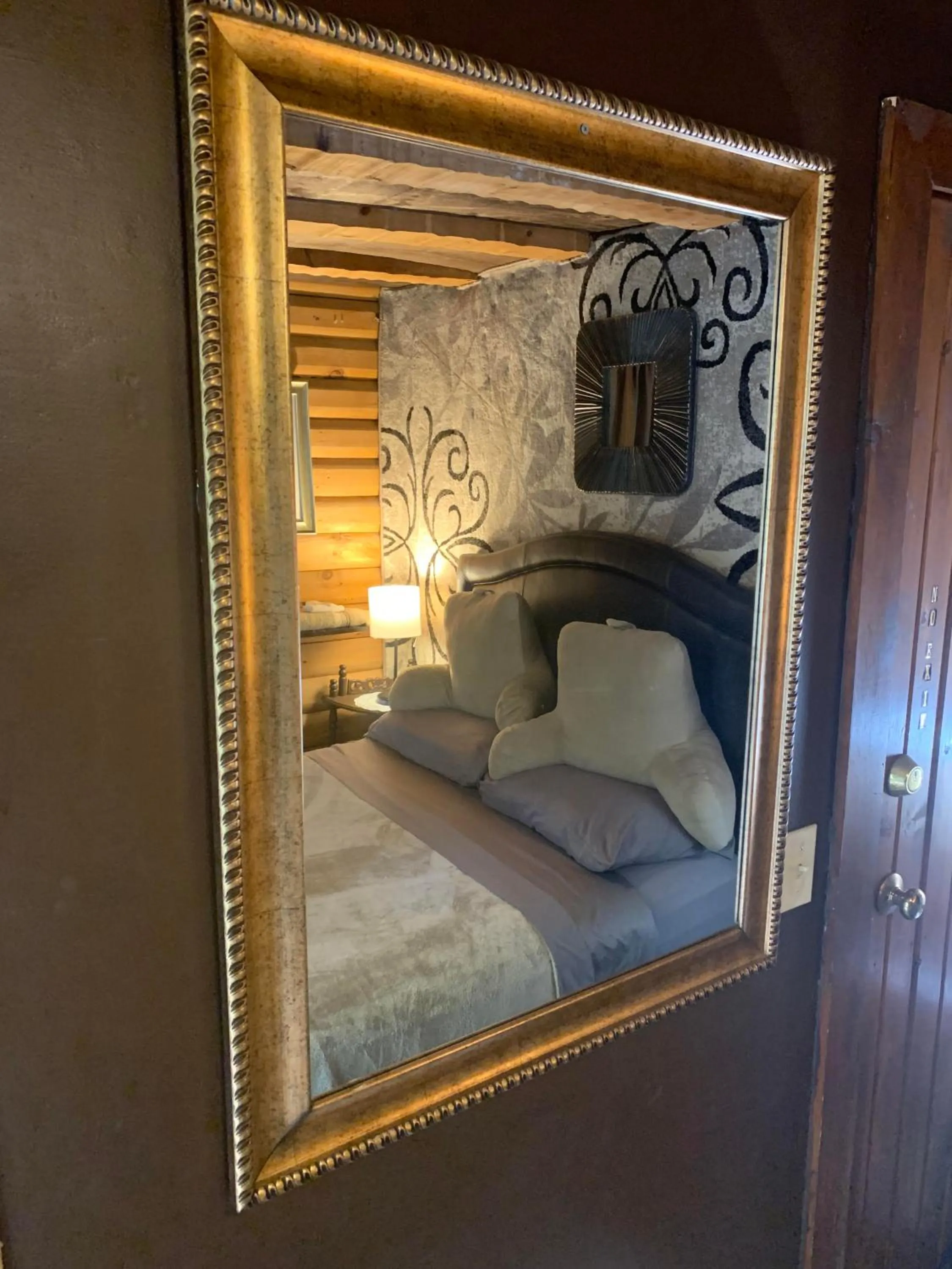 Bed in Log Cabin in the Field