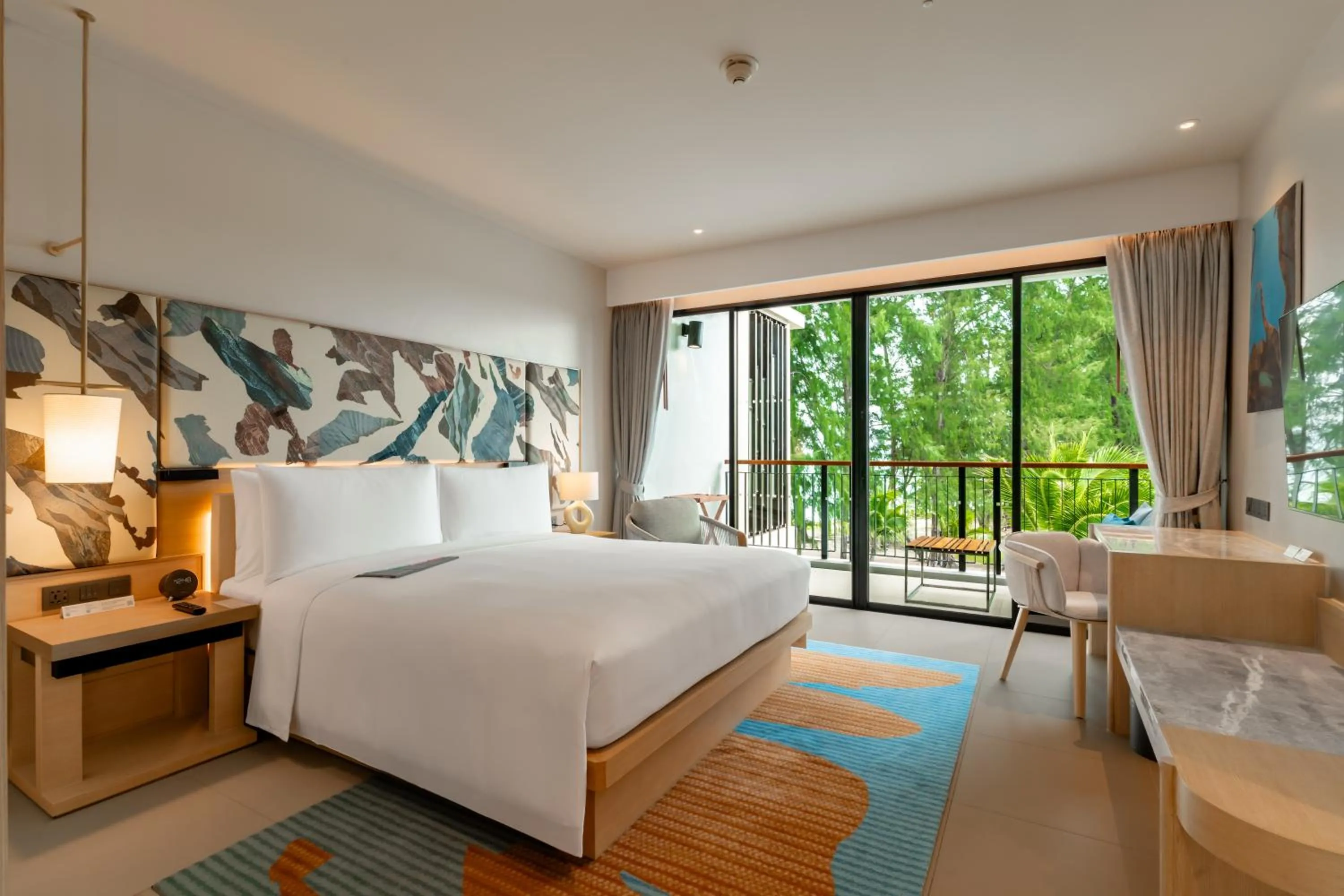 Bed in Le Meridien Phuket Mai Khao Beach Resort