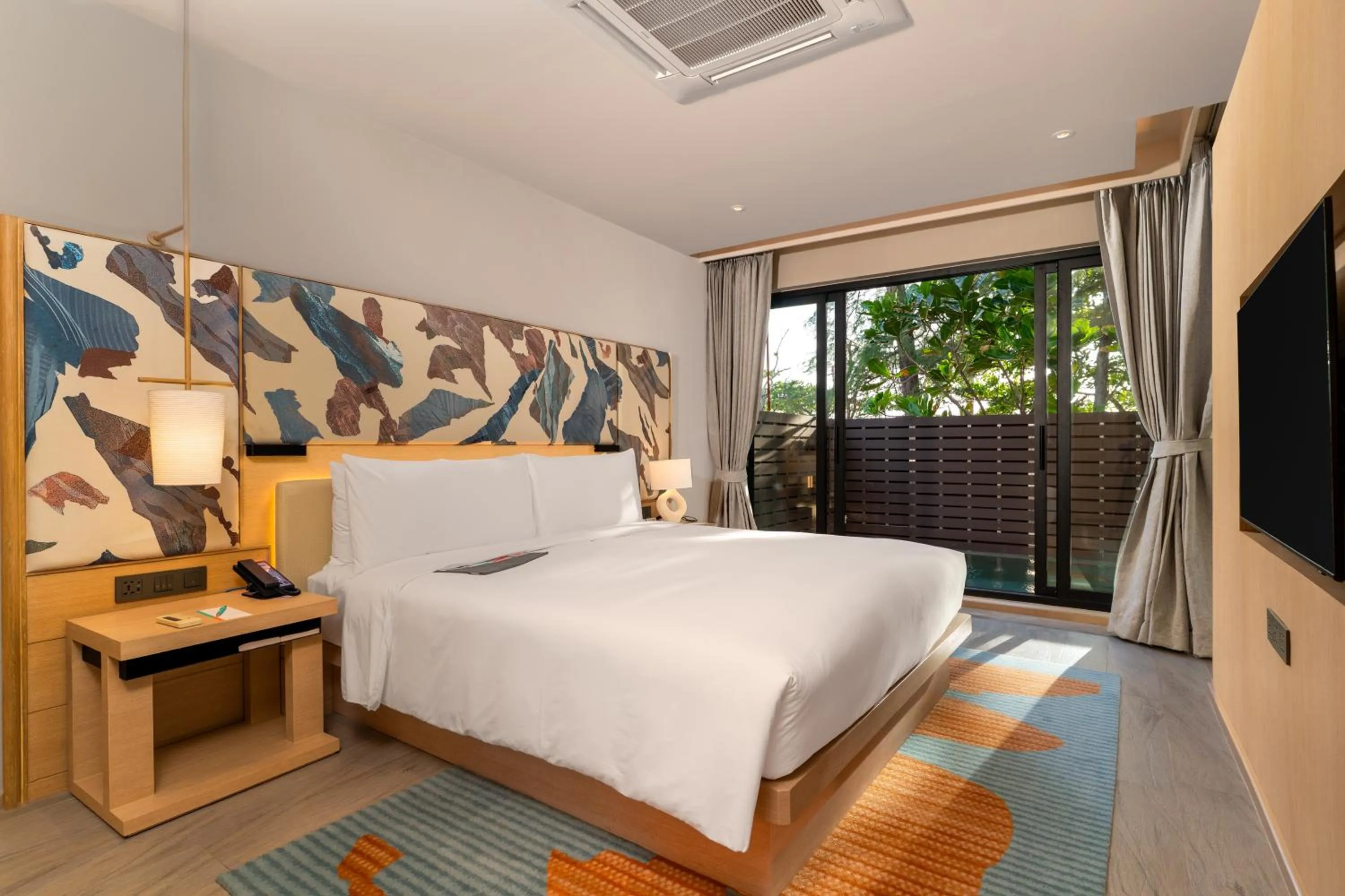 Bed in Le Meridien Phuket Mai Khao Beach Resort