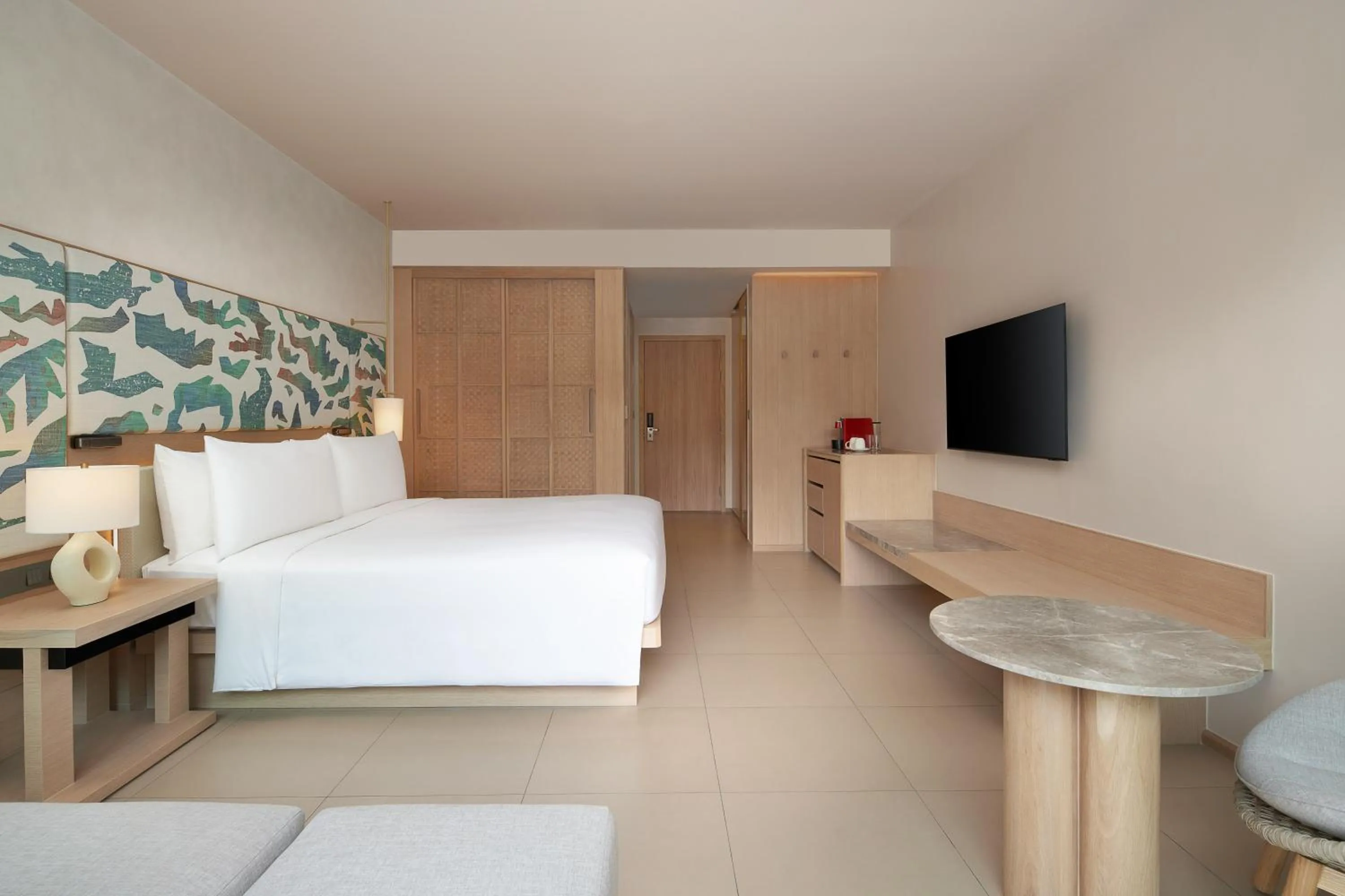 Bed in Le Meridien Phuket Mai Khao Beach Resort