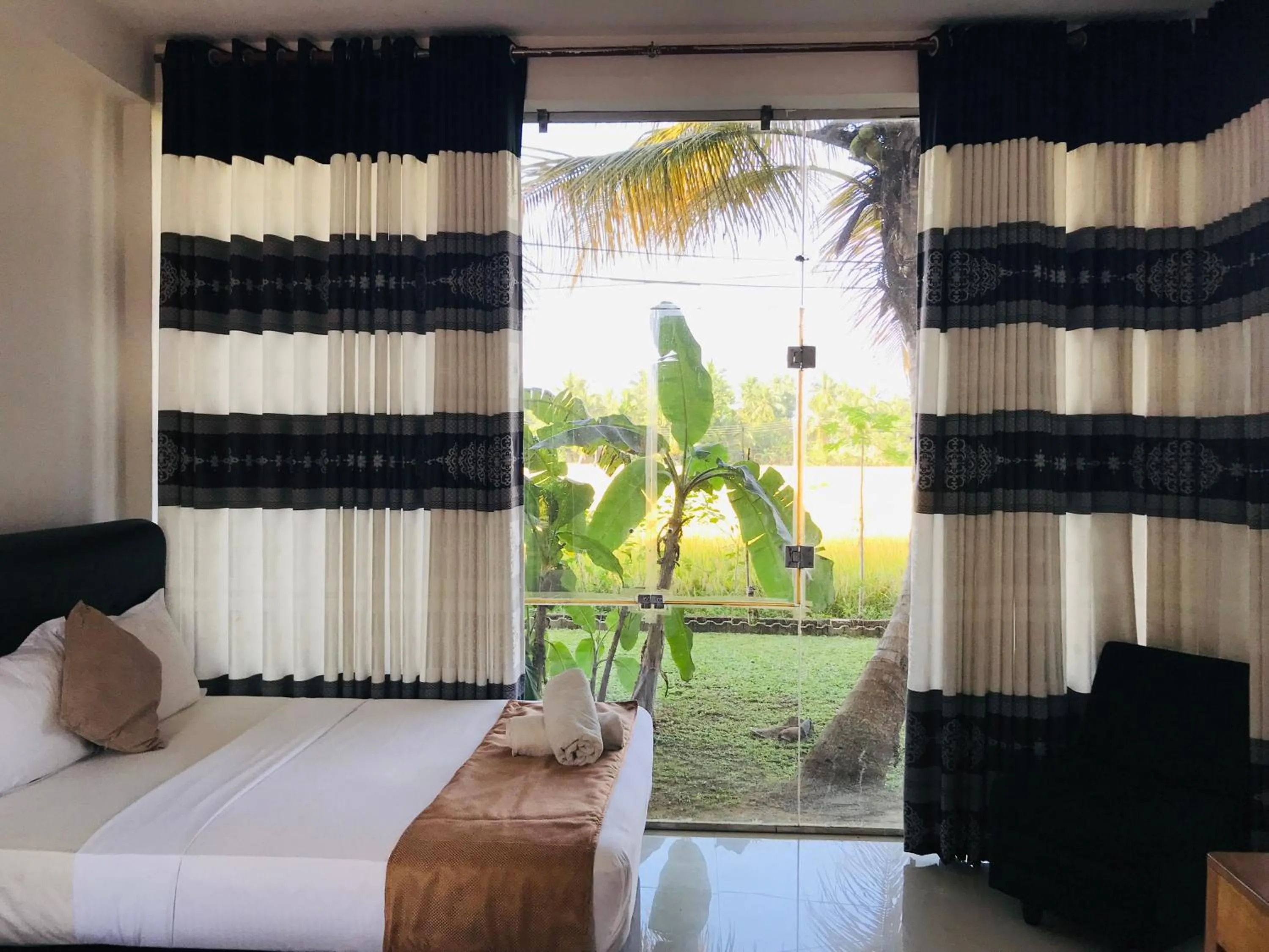 View (from property/room), Bed in Rivonway Hotel Polonnaruwa