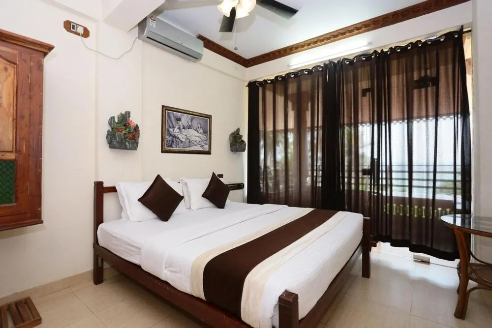 Photo of the whole room, Bed in Kovalam Beach Hotel