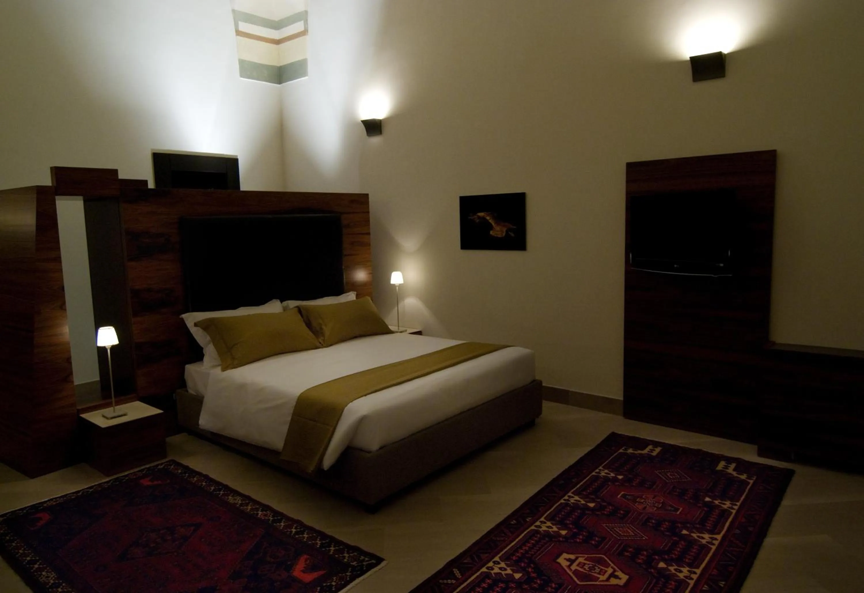 Bed in Alvino Suite And Breakfast