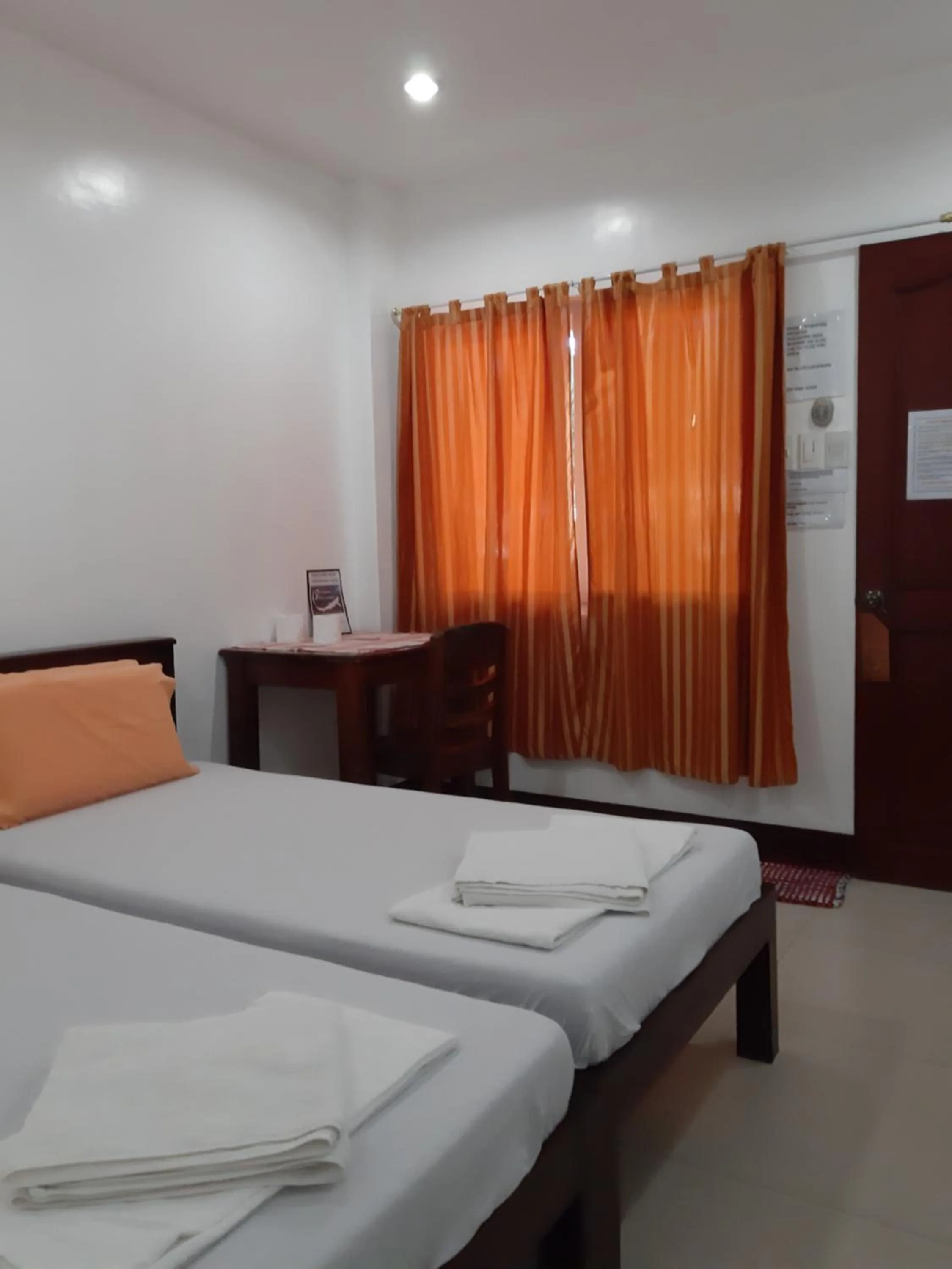 Bed in SLAM'S Garden Dive Resort