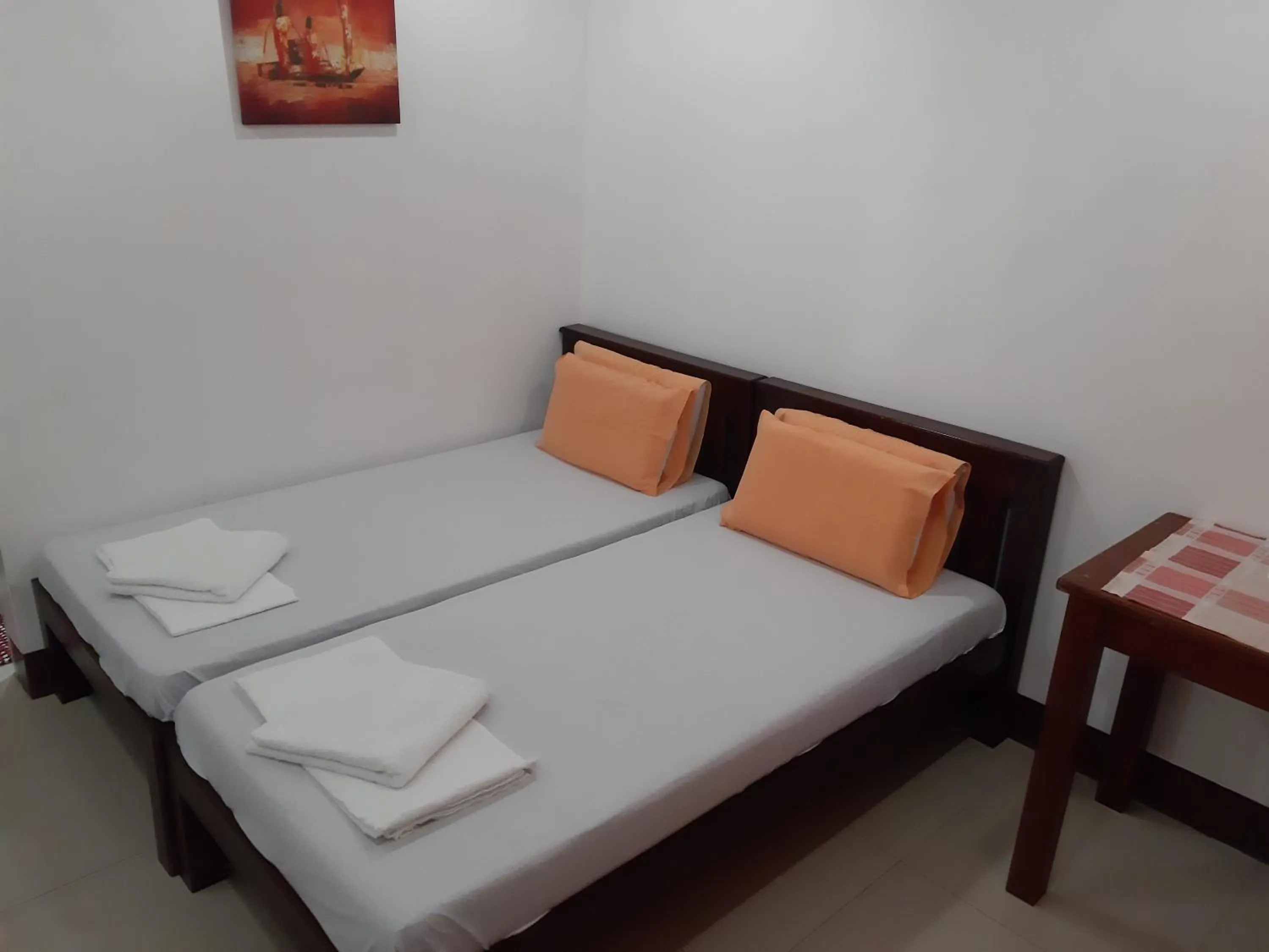 Bed in SLAM'S Garden Dive Resort