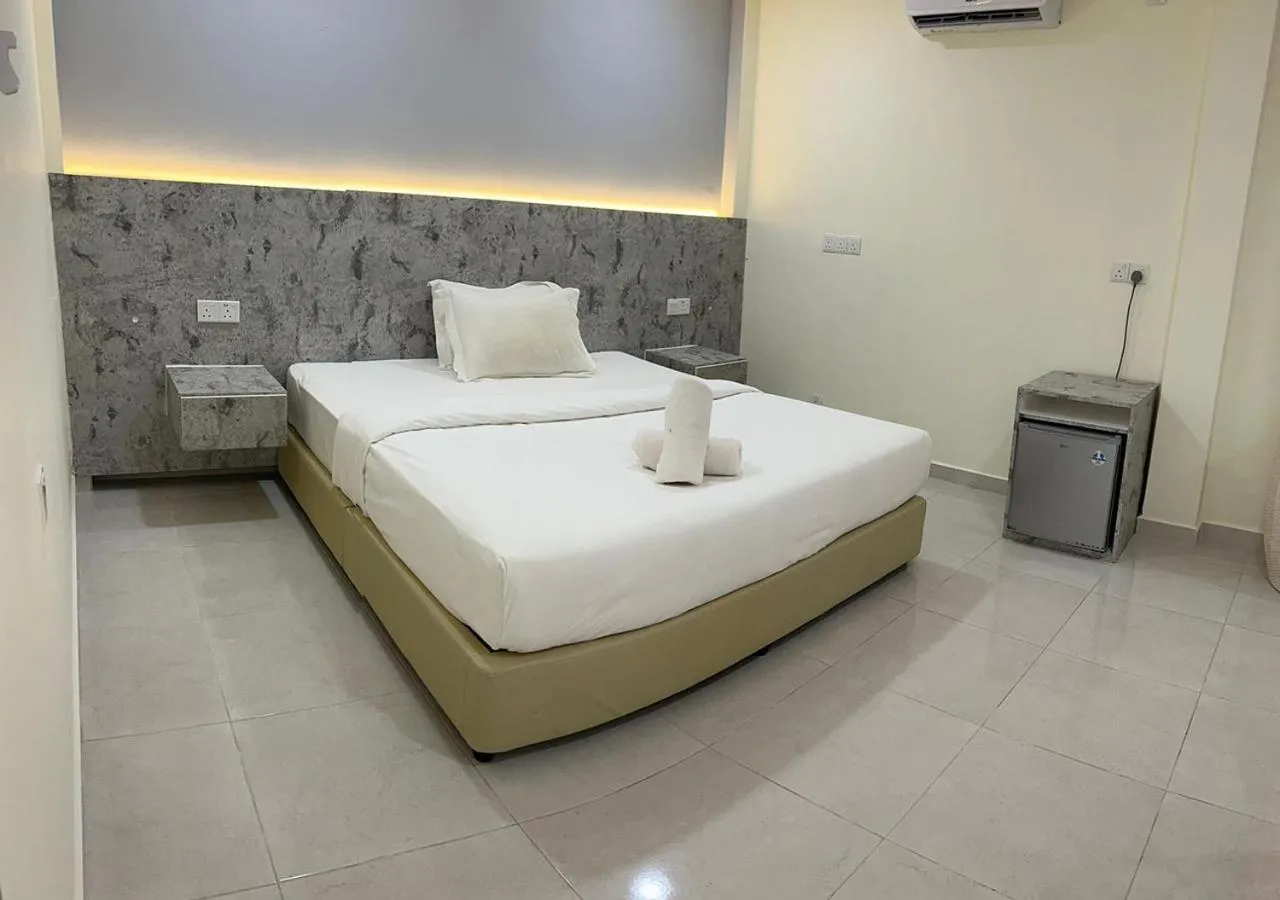 Bed in D'Lima Beach Inn