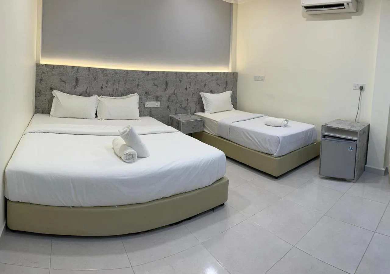 Bed in D'Lima Beach Inn