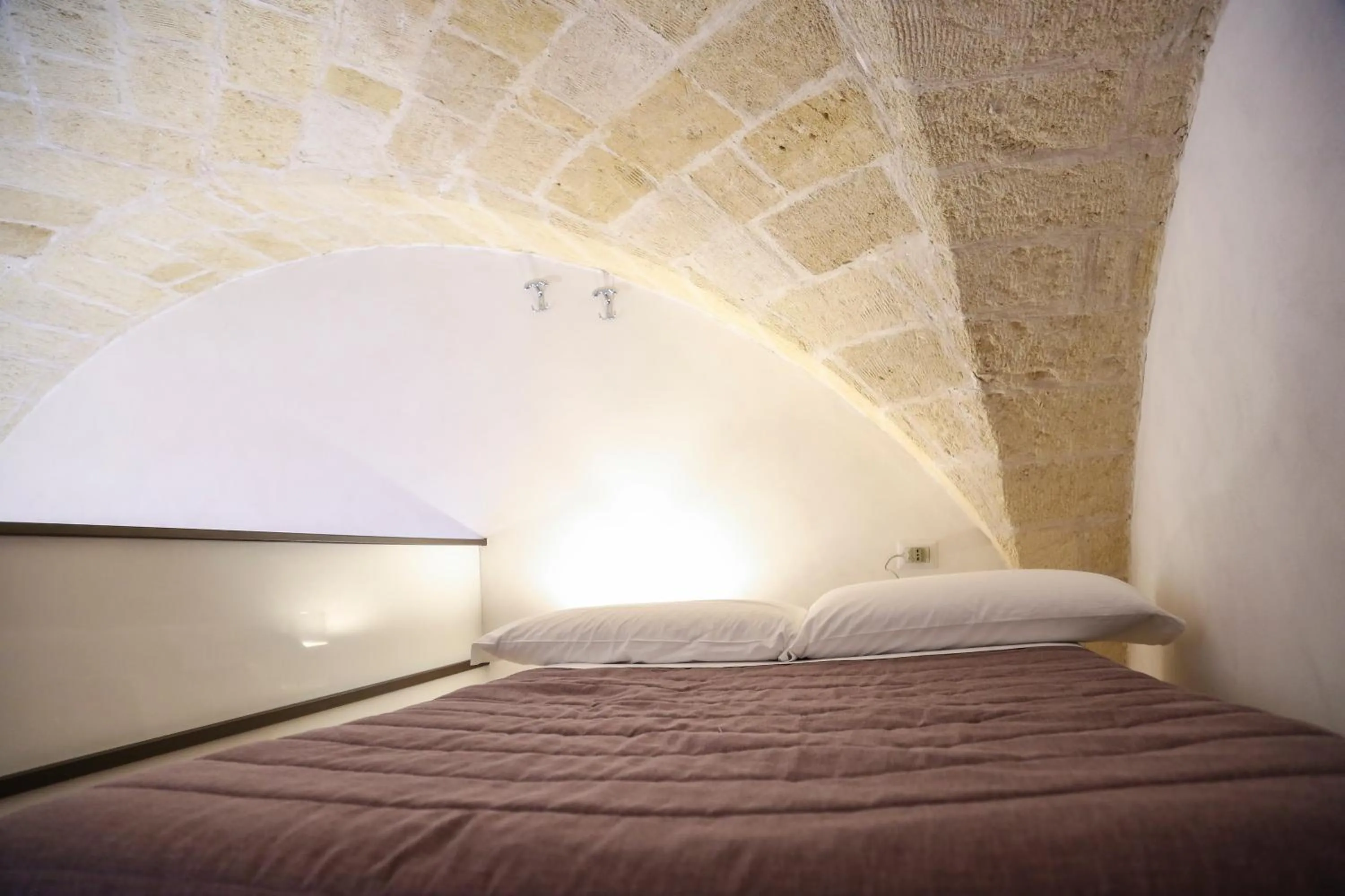 Bed in The Bridge Suites