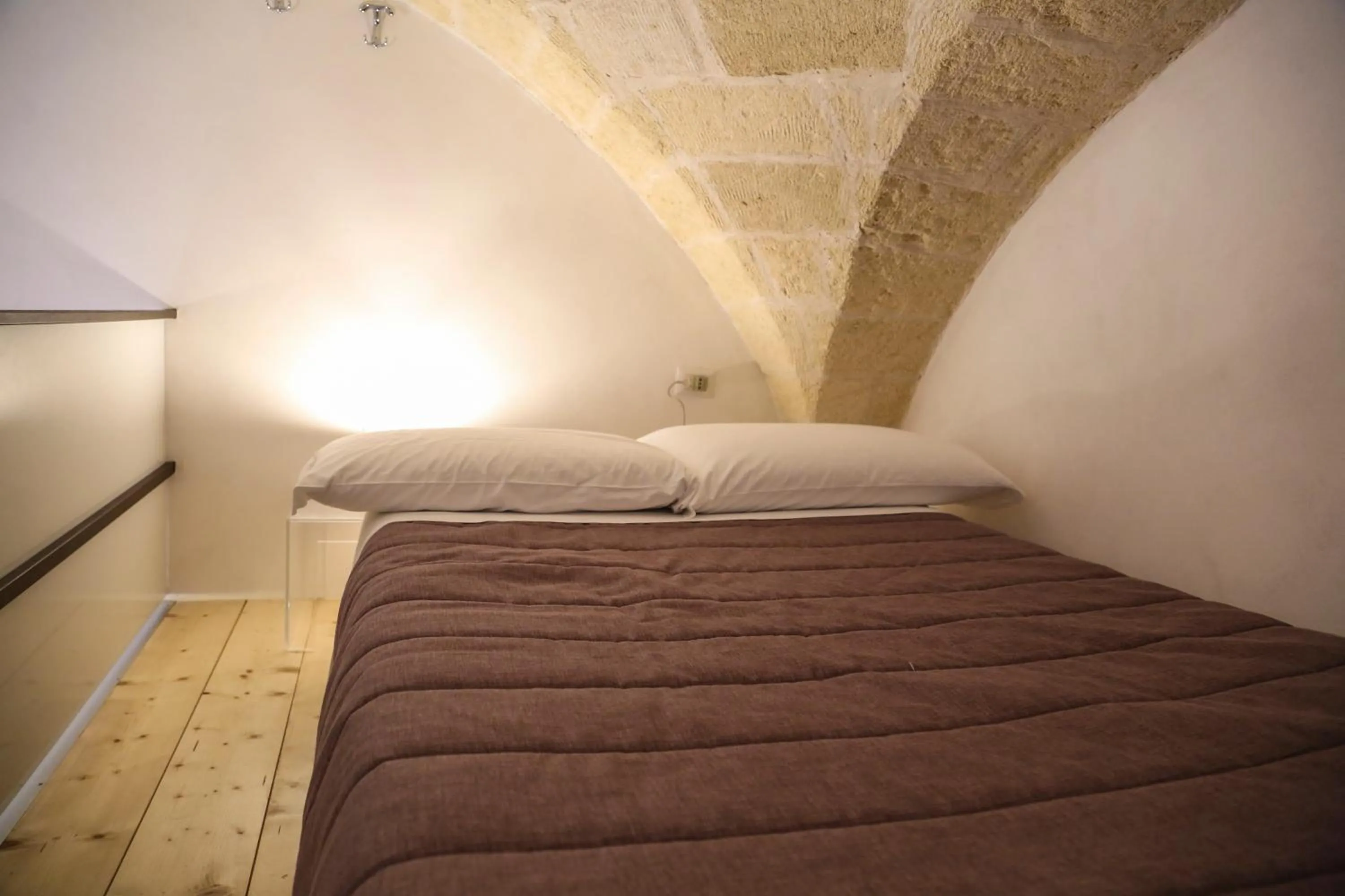 Bed in The Bridge Suites