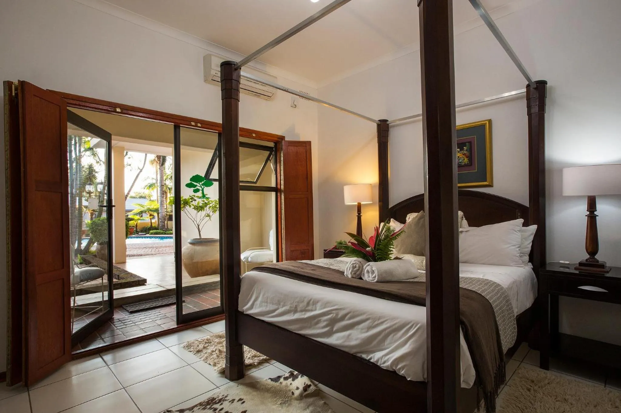 Bed in Tamboti Lodge Guest House