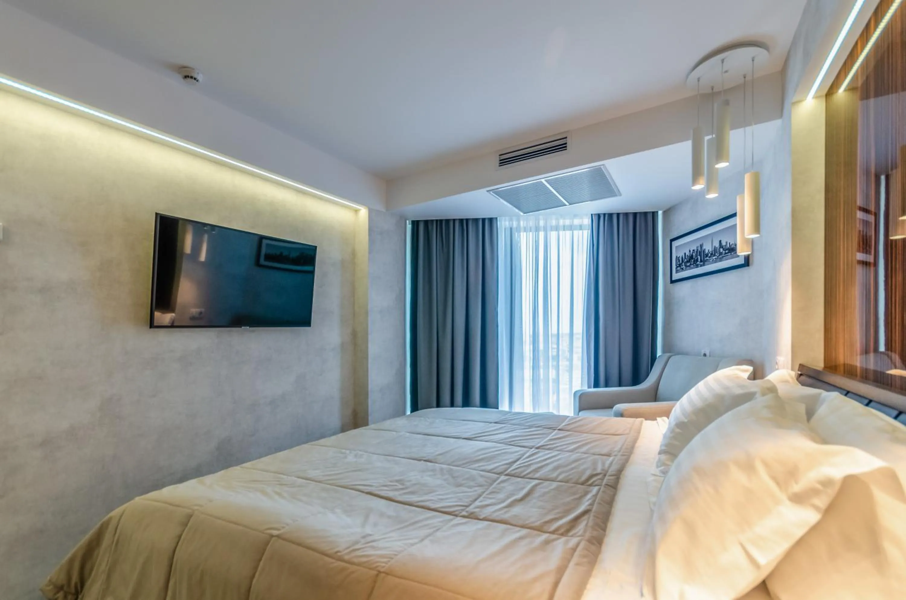 Communal lounge/ TV room, Bed in Tourist Hotel Complex