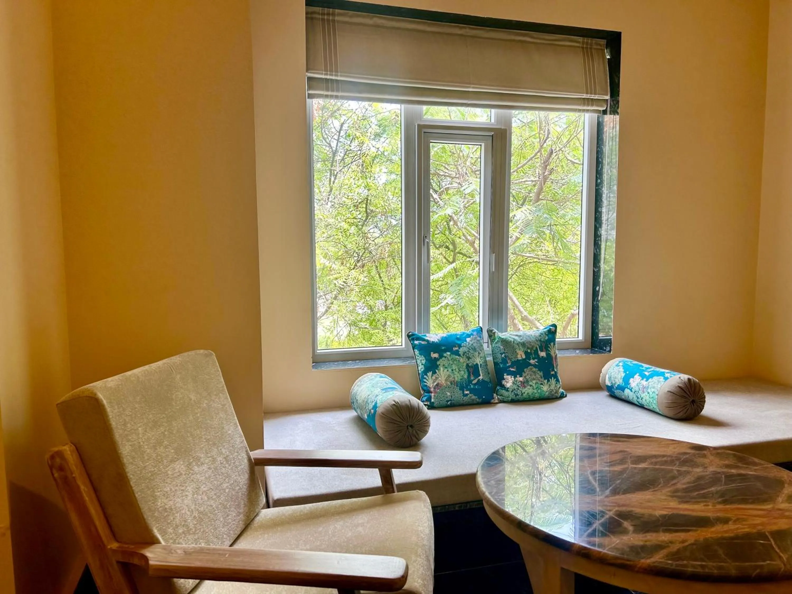 Seating area in Umaid Palace - A Lakeside Resort - 25 minutes from Mehandipur Balaji - 20 minutes from Chand Baori Stepwell Abhaneri & 40 minutes from Bhangarh Fort