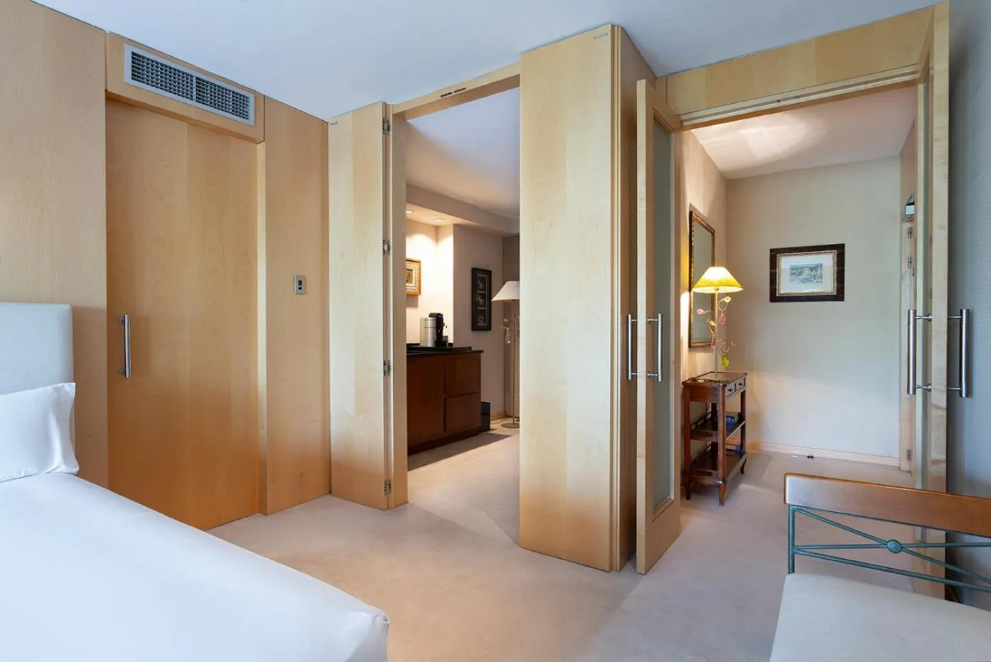 Bed in Suites del Mar Fenals Apartments