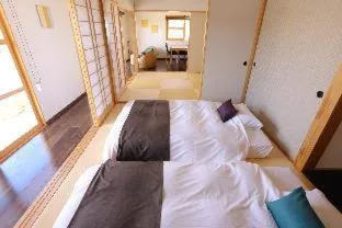 Bed in Tabinoteitaku Okinawa Nakijin HOMANN CONCEPT