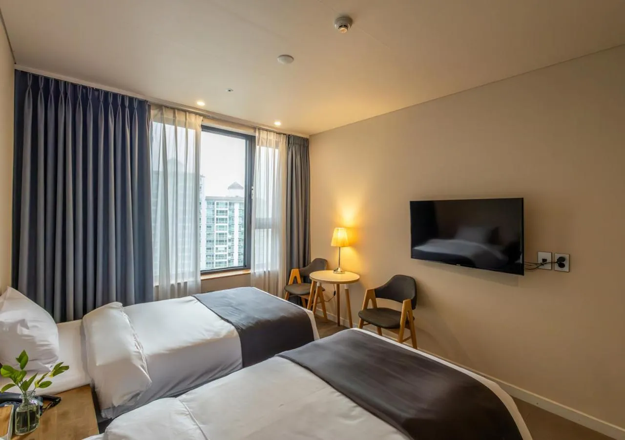 Bedroom, Bed in JK Blossom Hotel