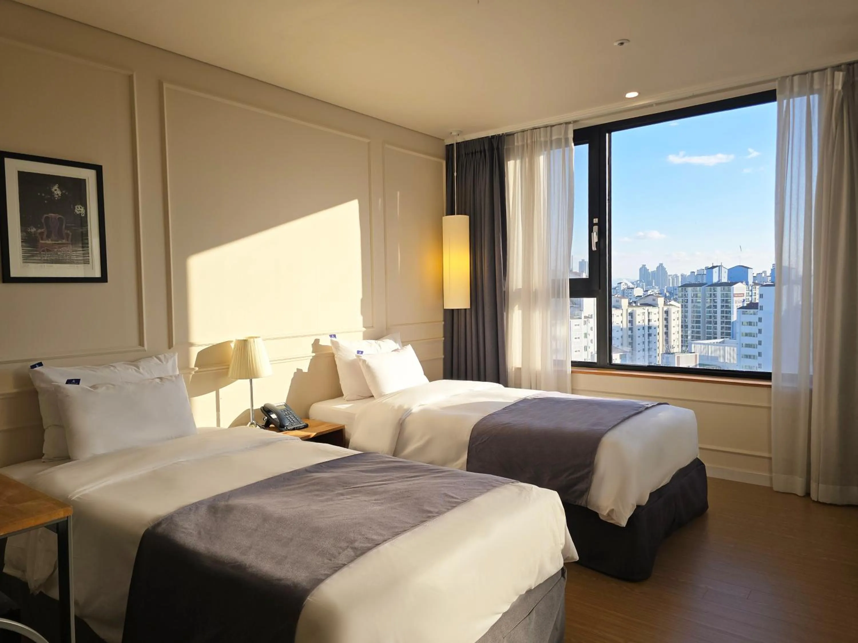 Bed in JK Blossom Hotel