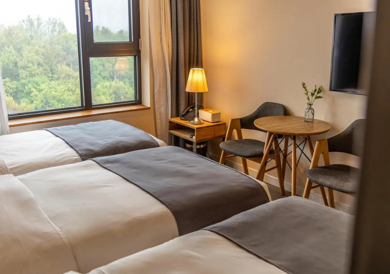 Bedroom, Bed in JK Blossom Hotel