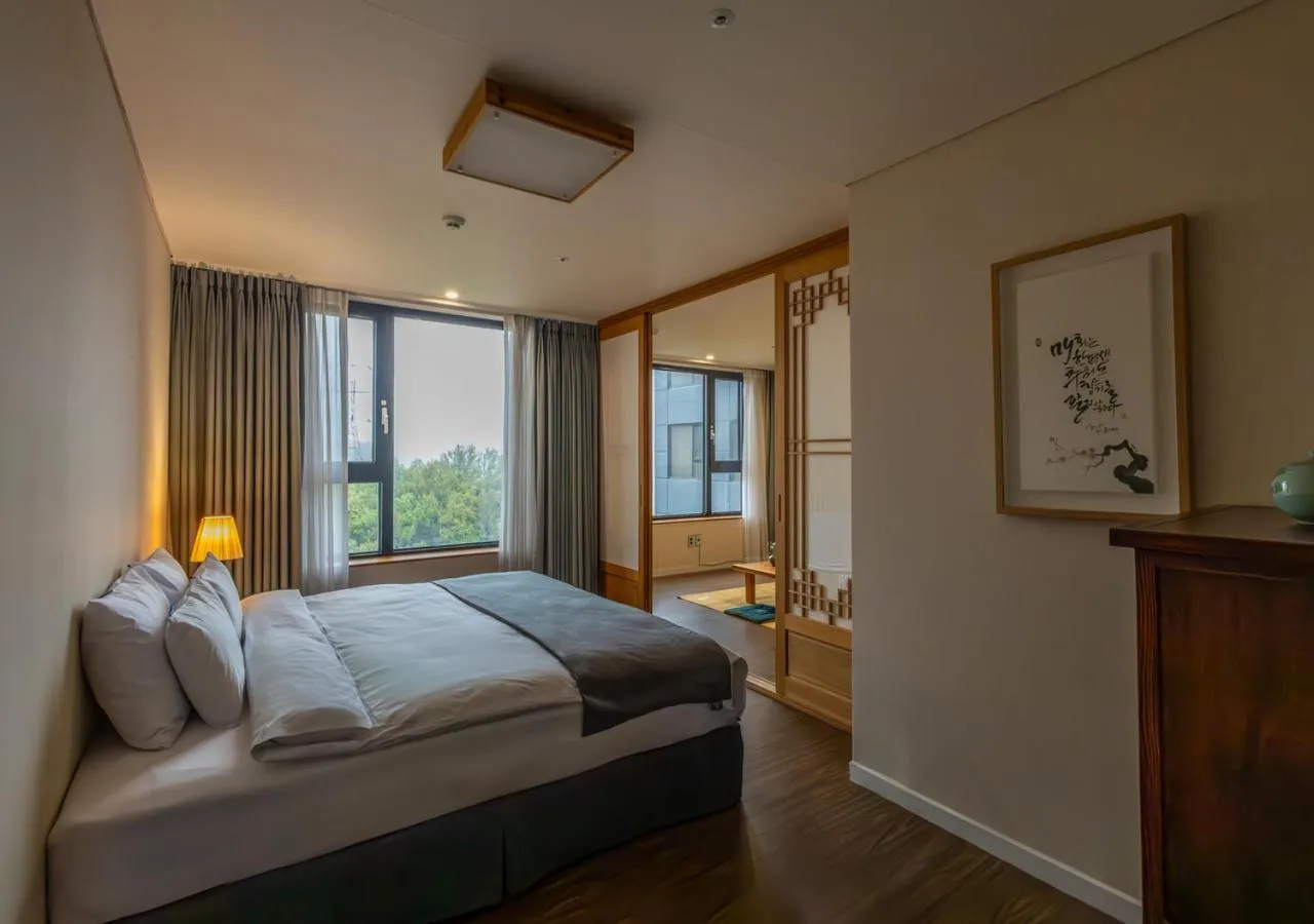 Bedroom, Bed in JK Blossom Hotel