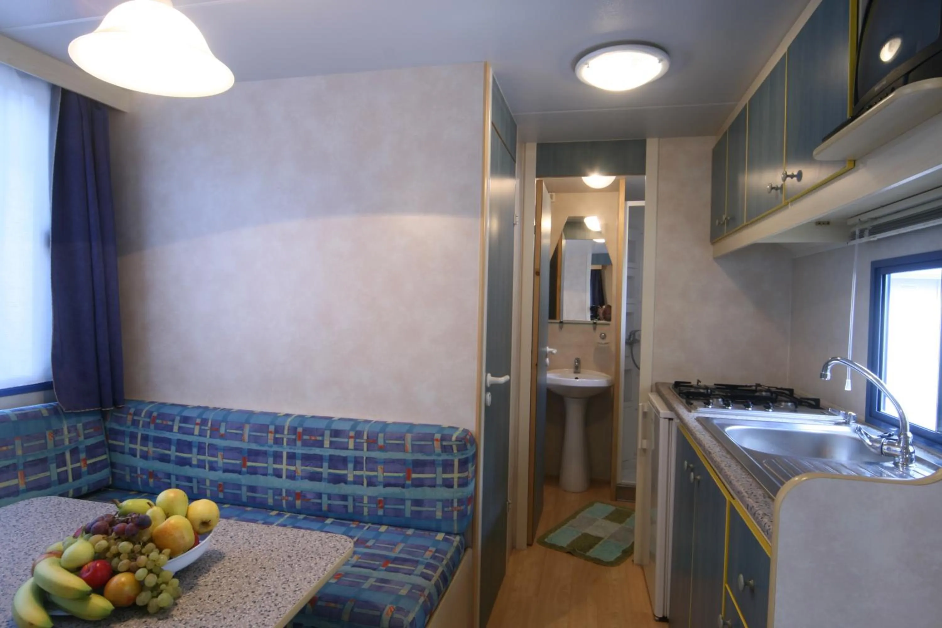 Kitchen or kitchenette in Camping Village Laguna Blu