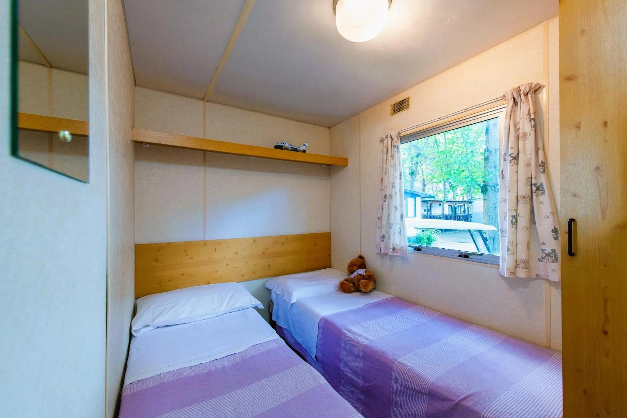 Bed in Camping Village Punta Navaccia